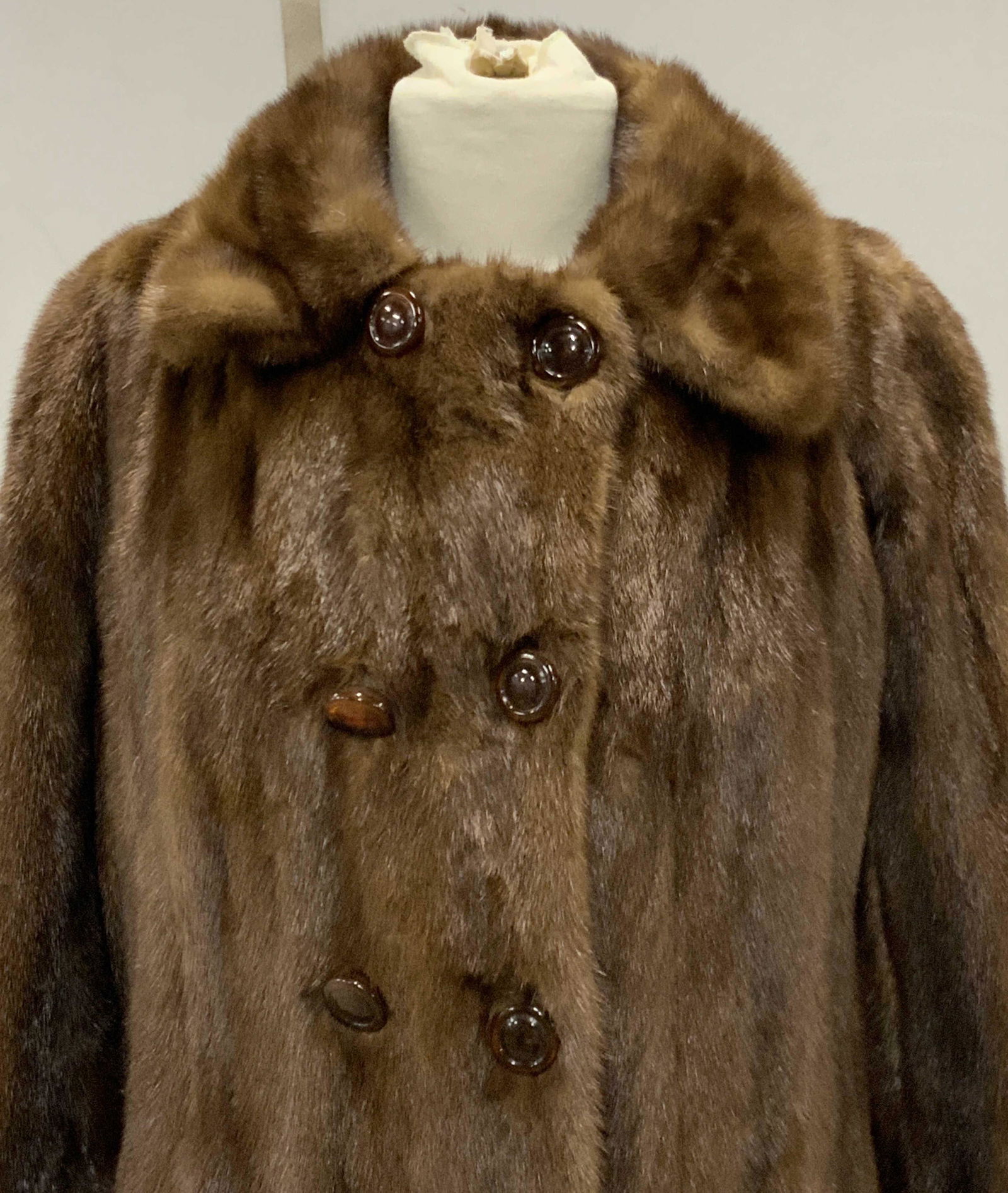 Leaf’s Vintage Mink Fur Waistcoat: Brown fur waistcoat with brown button closures. Fully lined, brown interior. 2 exterior pockets. Upper arm & back stitching rips needs repair. Minor repair of buttons needed, loose string. Interior st