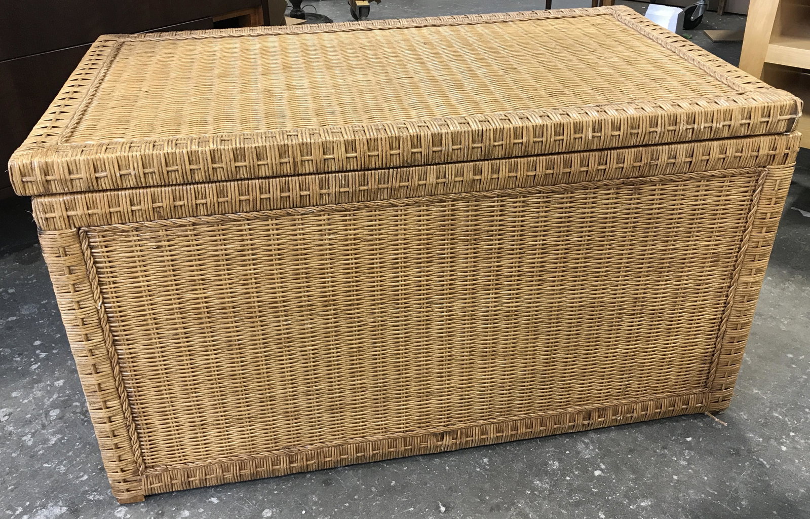 Vintage Woven Rattan Chest: Vintage chest. Crafted from woven rattan, and wood. Wooden interior, rattan exterior. Handles are metal, metal mechanisms hold lid open once in an upright position. Measures approx 20.25 inches H, 36 