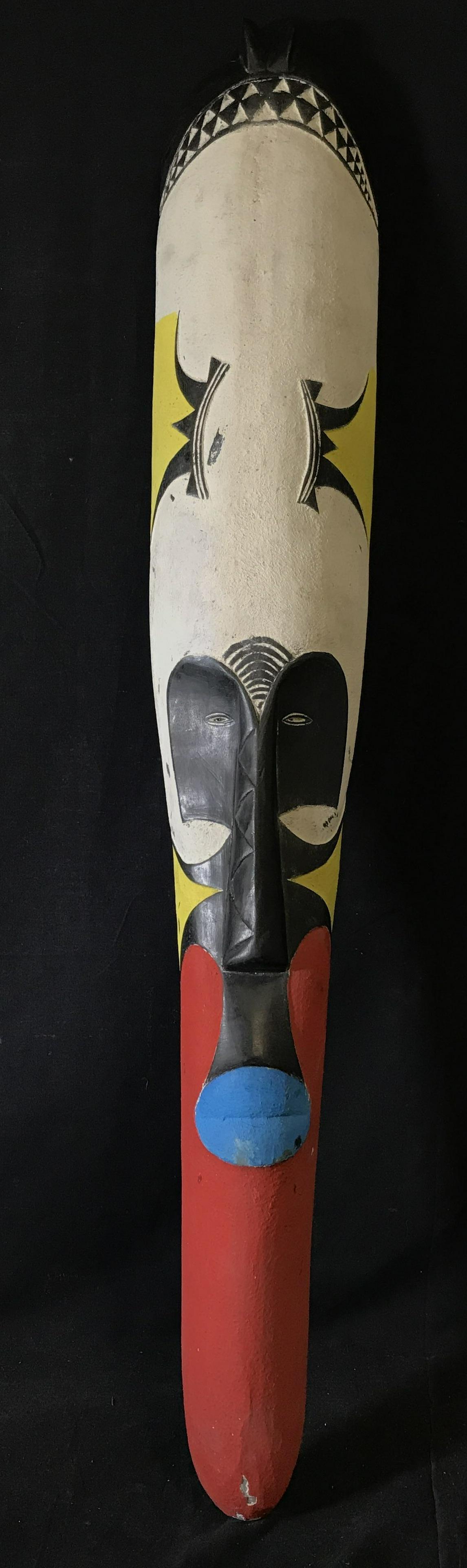 Gabon Long Fang Mask: Long Fang Gabon Mask, origins can be found in Gabon Central Africa, hand carved from one block of wood, painted with blue red yellow white and black pigment, approximately 44 inches at tallest 7 inche