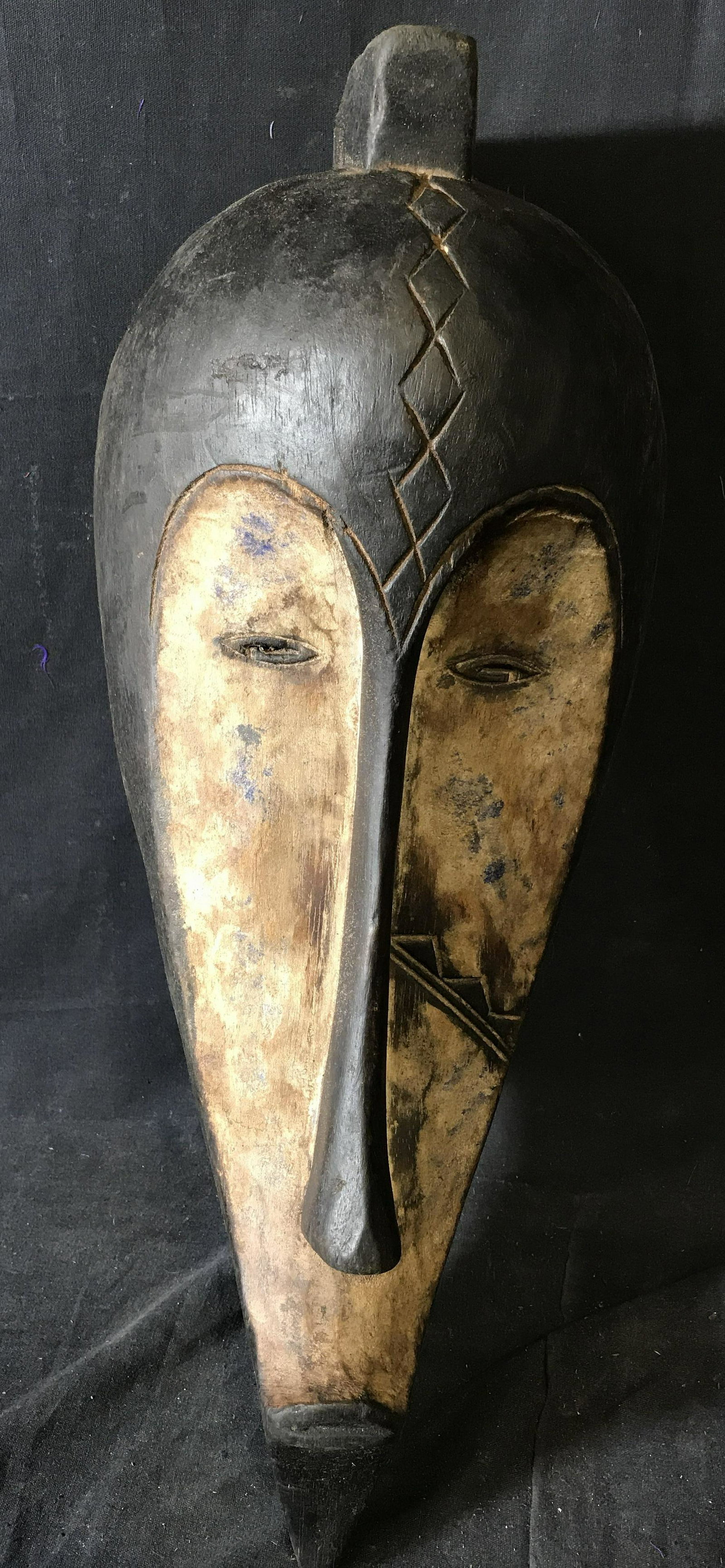 Gabon Fang Mask: Fang Gabon Mask, origins can be found in Gabon Central Africa, hand carved from one block of wood, painted with blue white and black pigment, approximately 18.5 inches at tallest 8 inches at widest, s