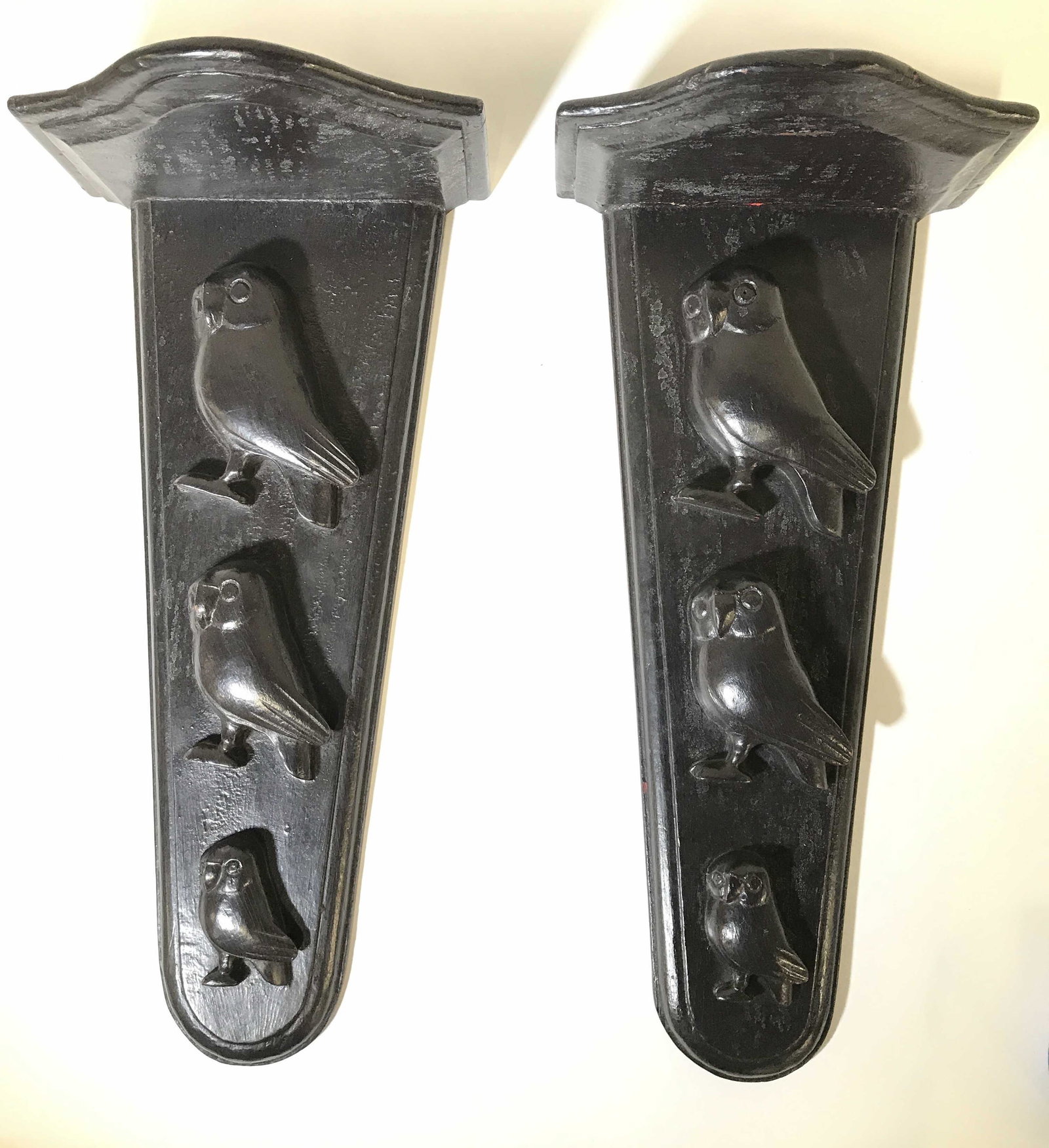 Antique Pair Owl Figural Wooden Wall Plaques: Wall shelves are dark brown toned and wooden. Pieces are vintage possibly antique. Each shelf has 3 Carved wooden owl Figurals. Each measures approximately 21 inches tall 10 inches wide 6 inches deep.