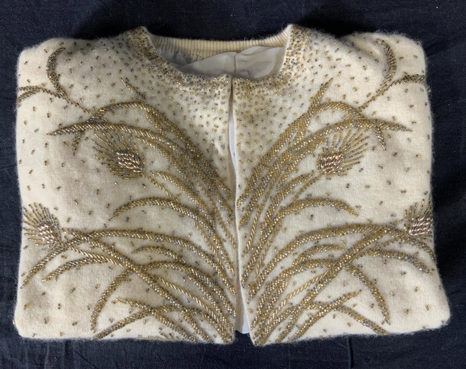 Vintage ILA Lambs Wool Cardigan: Vintage ILA Lambs Wool Cardigan, label to interior reads ‘30% Angora 70% Lambswool’, silk inner lining, label to interior of garment bag reads ‘ILA A Product of American Handicraft’, hook and 