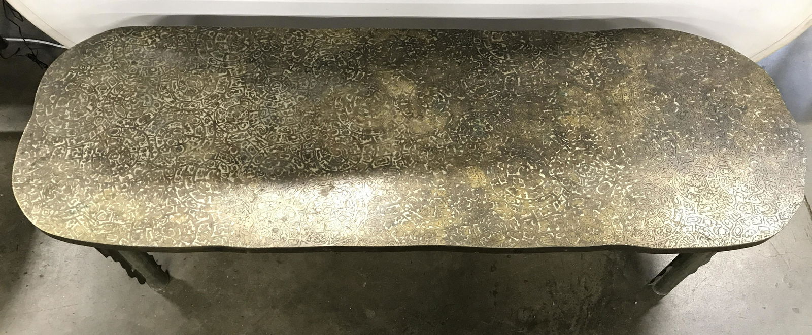 LaVerne Acid Etched Patinated Brass MCM Table: Coffee table is acid etched and patinated brass over pewter and wood with geometric & motif detail on table top. Legs appear to possibly be pewter. 69 in long, 23 in wide, 17 in tall. Some general wea