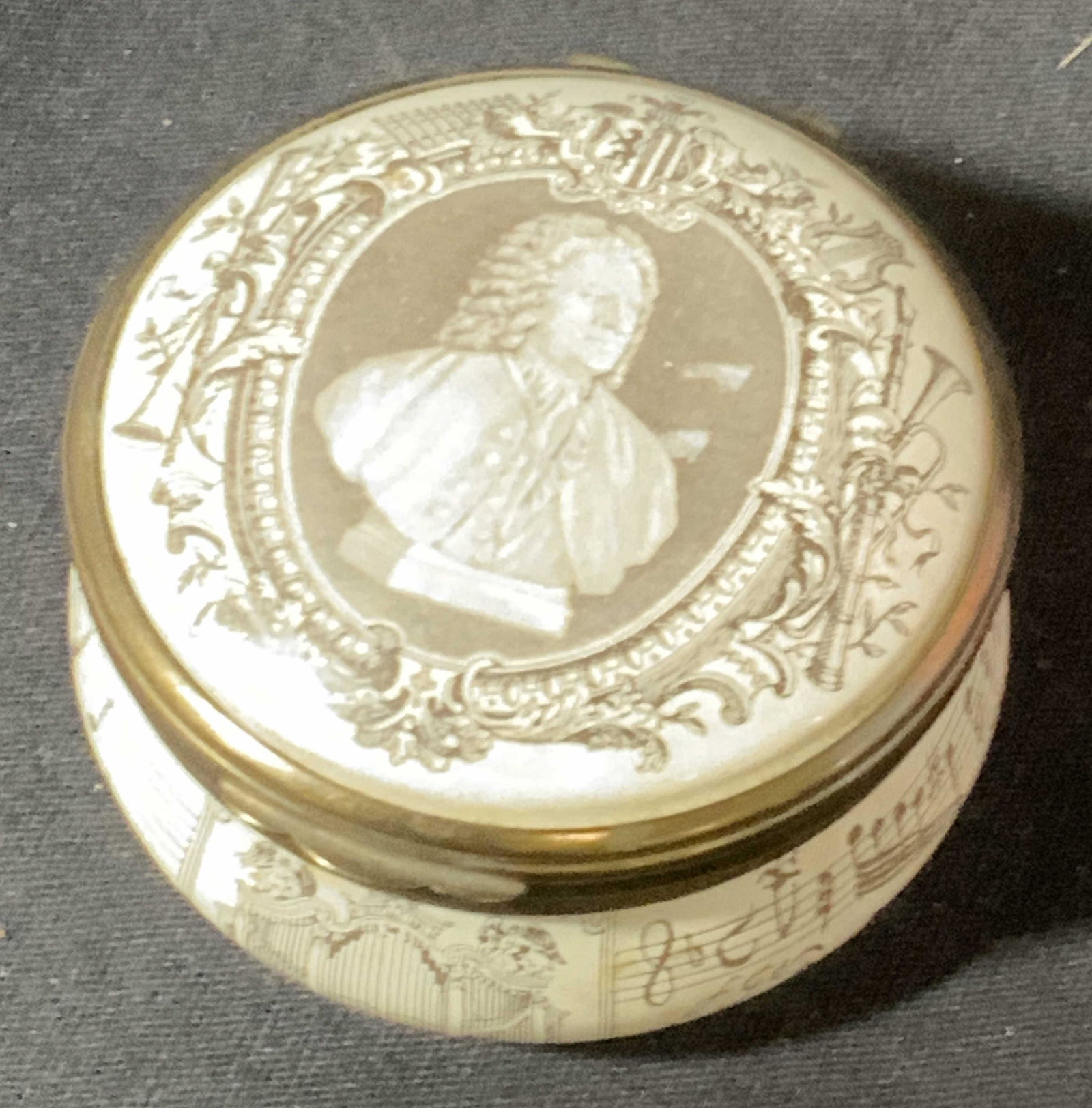 CARTIER Lux Enamel S. BACH Pillbox: trademark reads BILSTON & BATTERSEA ENAMELS Made in England. Trinket box / pill box with a transfer print of JOHANN SEBASTIAN BACH. on lid. Reads Cartier New York Hallmarked No. 917. Interior with bir