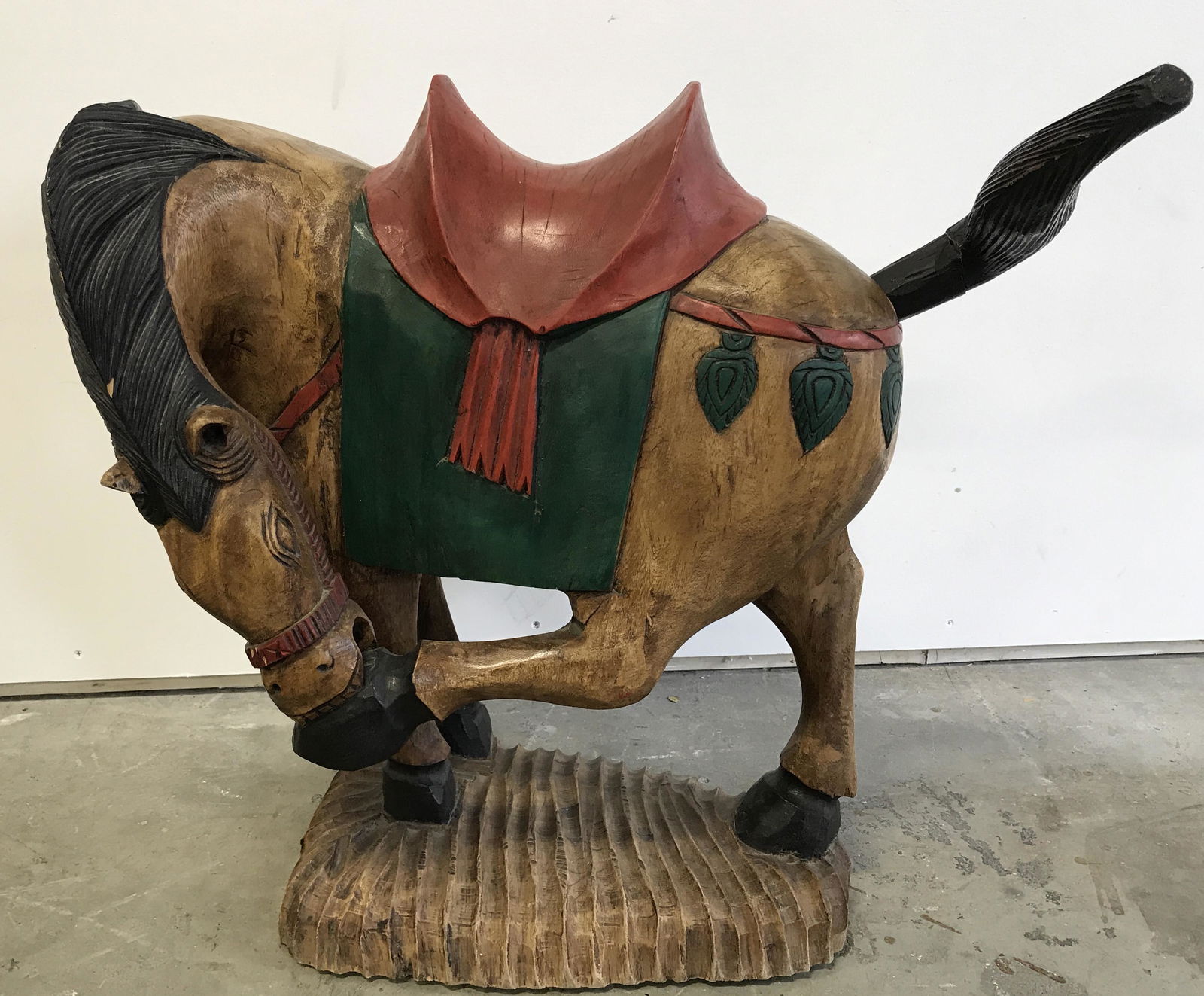 Wooden Horse Sculpture, 22 in HT: Wooden Horse Sculpture, no apparent signatures or stamps to surface, hand painted with red green and black paint, subject a horse biting at his back hoof, sculpture has base carved into it, some previ