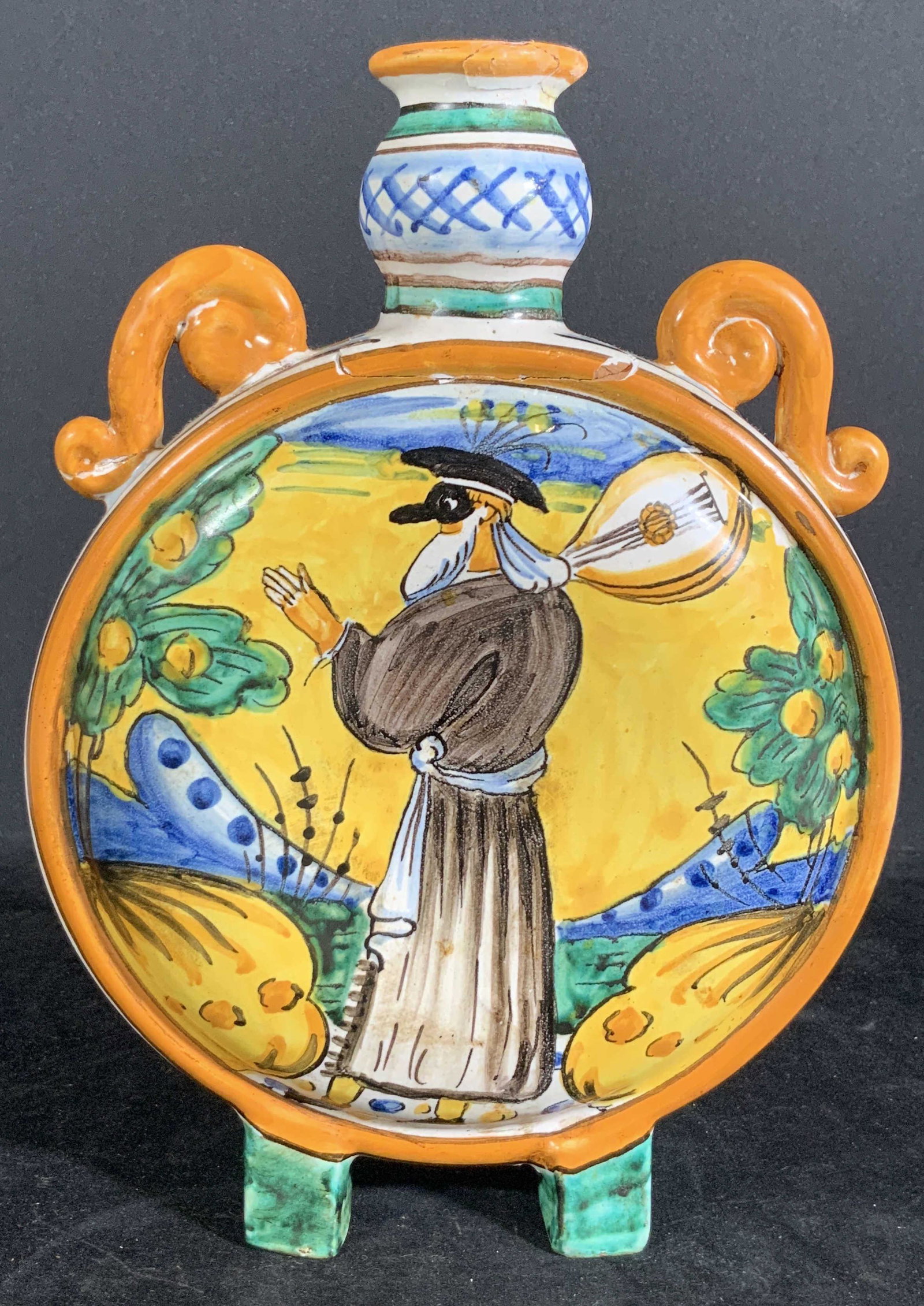 Vintage Signed DOLFI OTELLO Italian Ceramic Vessel: Vintage Hand painted ceramic vessel, moon flask, depicting a man wearing a mask and holding a mandolin. Background front and back depicts nature scene. Decorative handles. Repair at neck of vessel. Un