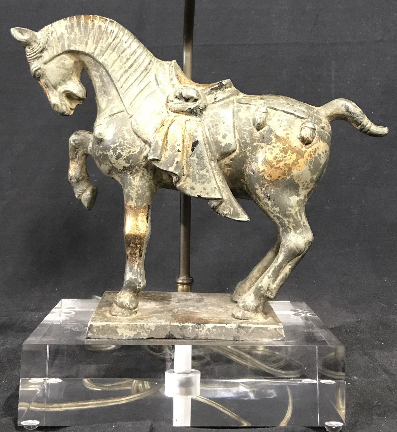 Vintage Metal Horse Figural Lamp W Lucite Base: Lamp is vintage possibly antique. Horse Figural is metal, possibly iron, possibly bronze. Base of piece is a rectangular prism. Base is lucite. Piece has 2 bulb sockets with dangling pull switches. La