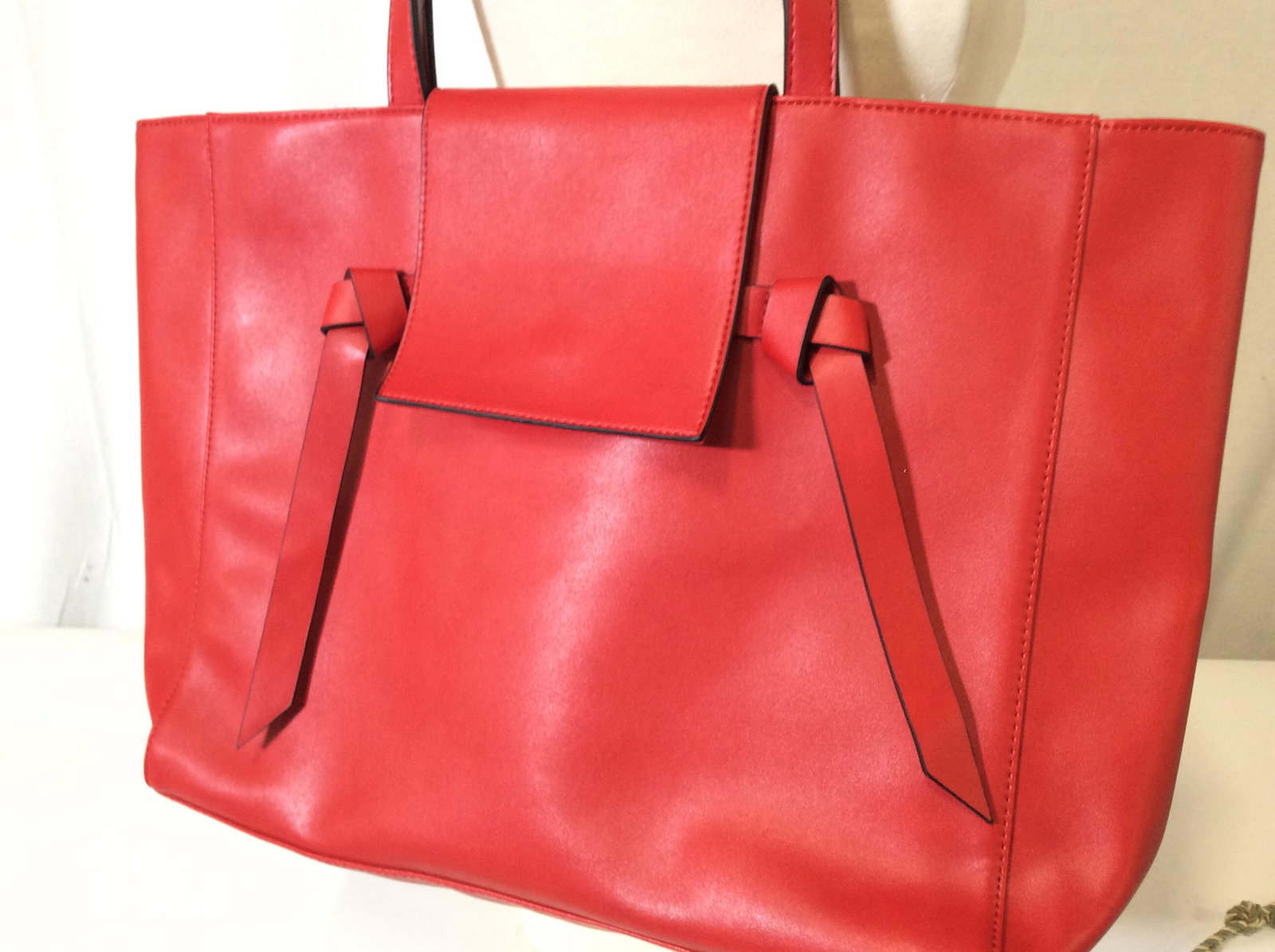 Elizabeth Arden Red Tote Purse: Large tote with flap and snap. PVC exterior ( feels like leather) & polyester lining . All red. Wipe clean. Handles drop 8.5 in. Good condition. 18 in long, ht 12 in. Depth 6. Elizabeth Arden Carry Al