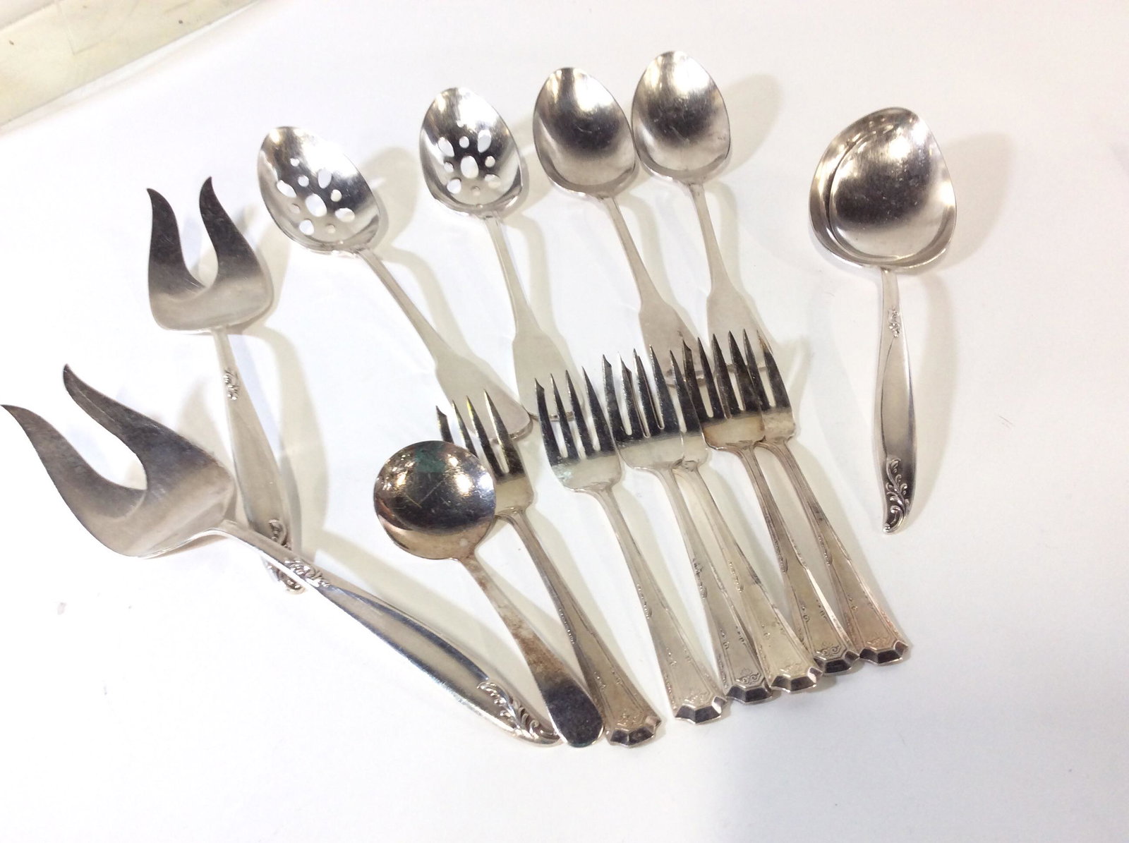 Lot Silver Plated Serving Flatware: 14 PCs total. Lot consists of set 4 RETRONEU 18-8 Korea Serving spoons, Pierced and solid, set 3 DEEP-SILVER Serving forks and casserole spoon 9 in. With embossed laurel tips. Set 6 ENGLISH PLATE Smal