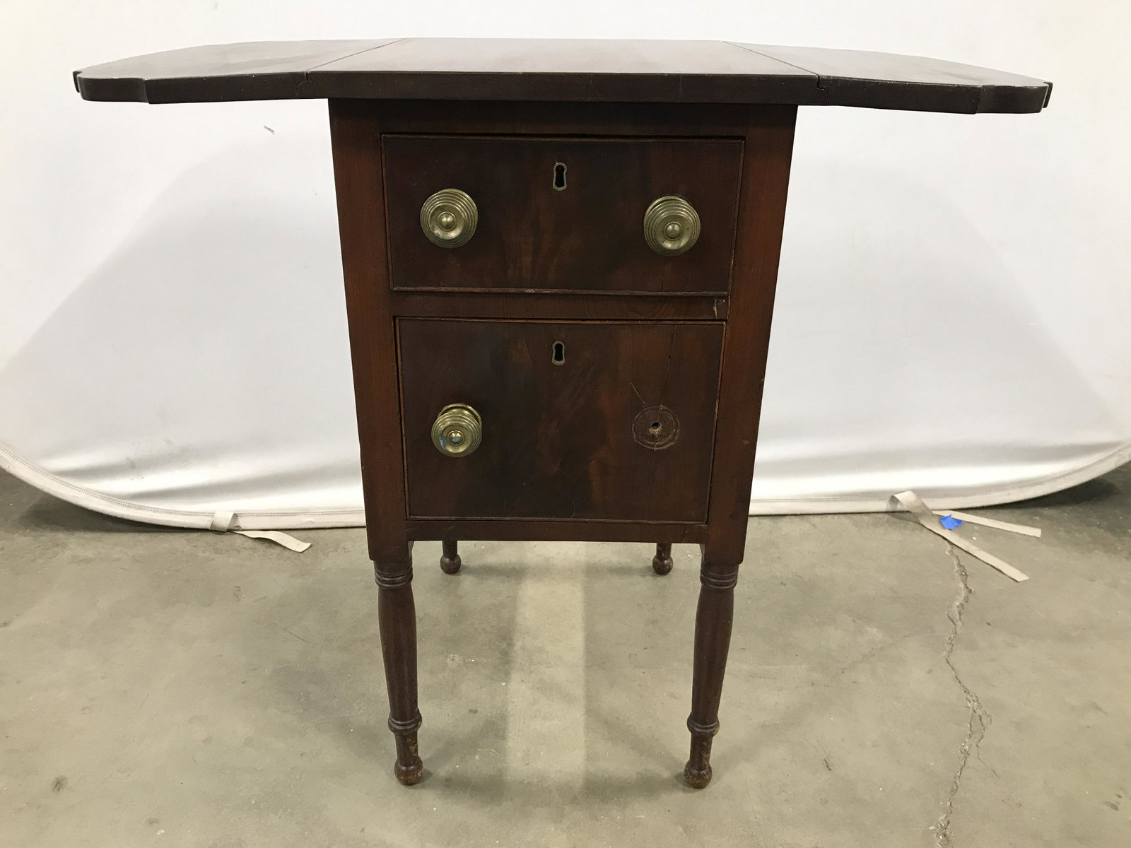Vintage Drop Leaf Wood Side Table W Drawers: Side table is vintage & wooden. Piece has drop leaf on each side. Drawers have gold toned brass knobs. Drawers have hand dovetailing. Side table, end table, drop leaf table, vintage side table, home f