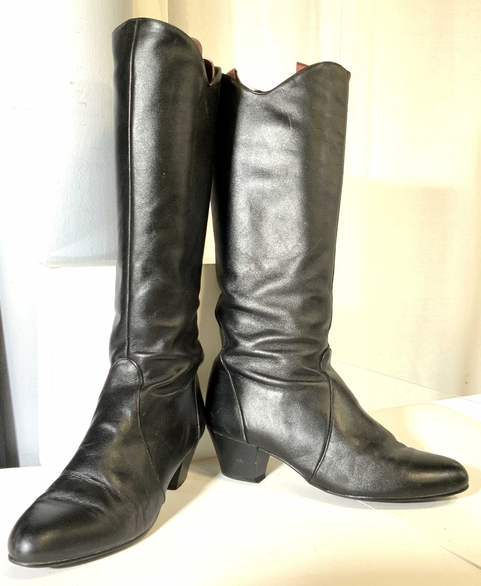 YKK Black Leather Mid-Calf Boots w/ Boot Shapers: Black leather heeled mid-calf boots. Zipper on side reads: YKK. Underside reads: Leather Upper, Other Parts Man Made. Other stamp on underside is worn, can only read: ACTW9. Pink boot shapers read: Du