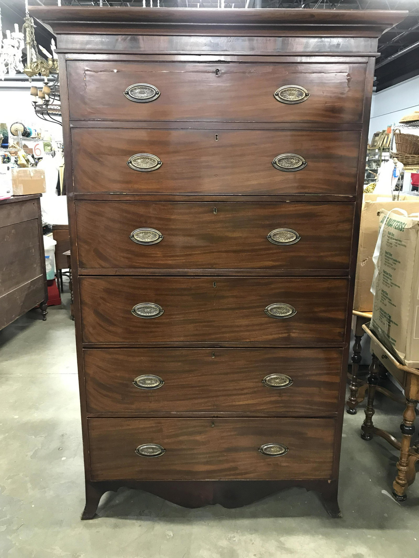 Vintage Carved Wooden Highboy Dresser: Dresser is vintage & wooden. Piece contains 4 mid size drawers And 1 large drawer at top. Drawers each have gold toned handles which appear to be brass. Top of piece can be separated from rest of piec