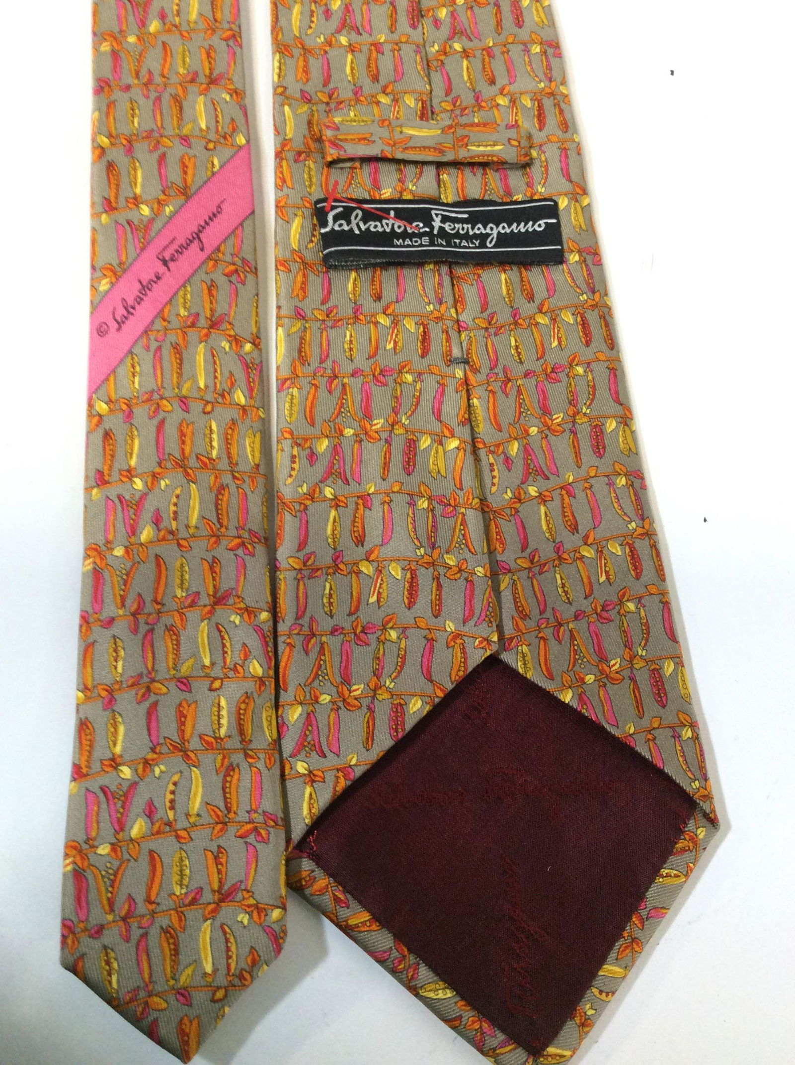Luxury Salvatore Ferragamo Chili Pepper Neckwear: SIGNED Salvatore Ferragamo Neck Tie, Made in Italy. 100% silk. Mocha color with subtle hot pink, orange and yellow chili peppers drying on a string. App 68 in. Long. Collectible Designer Salvatore Fer