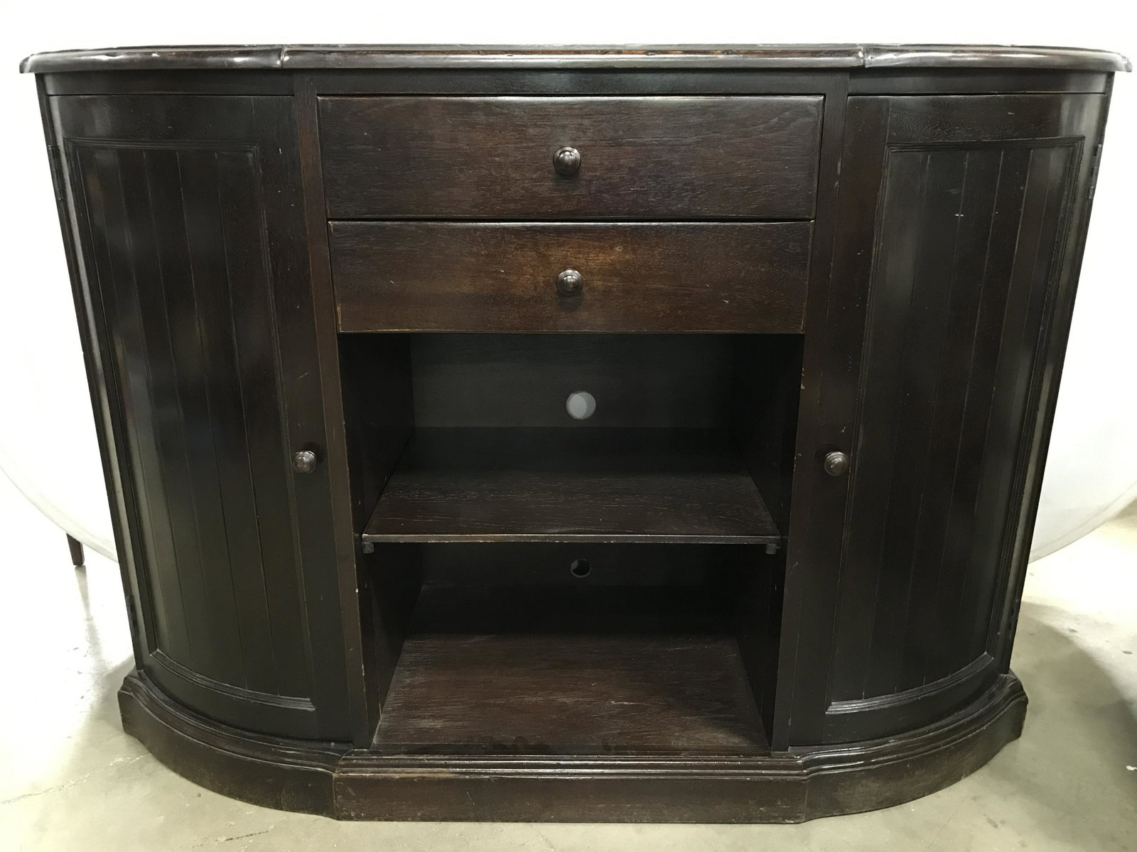 SOUTH CONE Vintage Wooden Sideboard: Interior of top drawer has tags which reads SOUTH CONE TRADING COMPANY. Piece is brown toned and wooden. Sideboard is vintage. Piece contains 2 side cabinet doors with shelf space 2 drawers & open she
