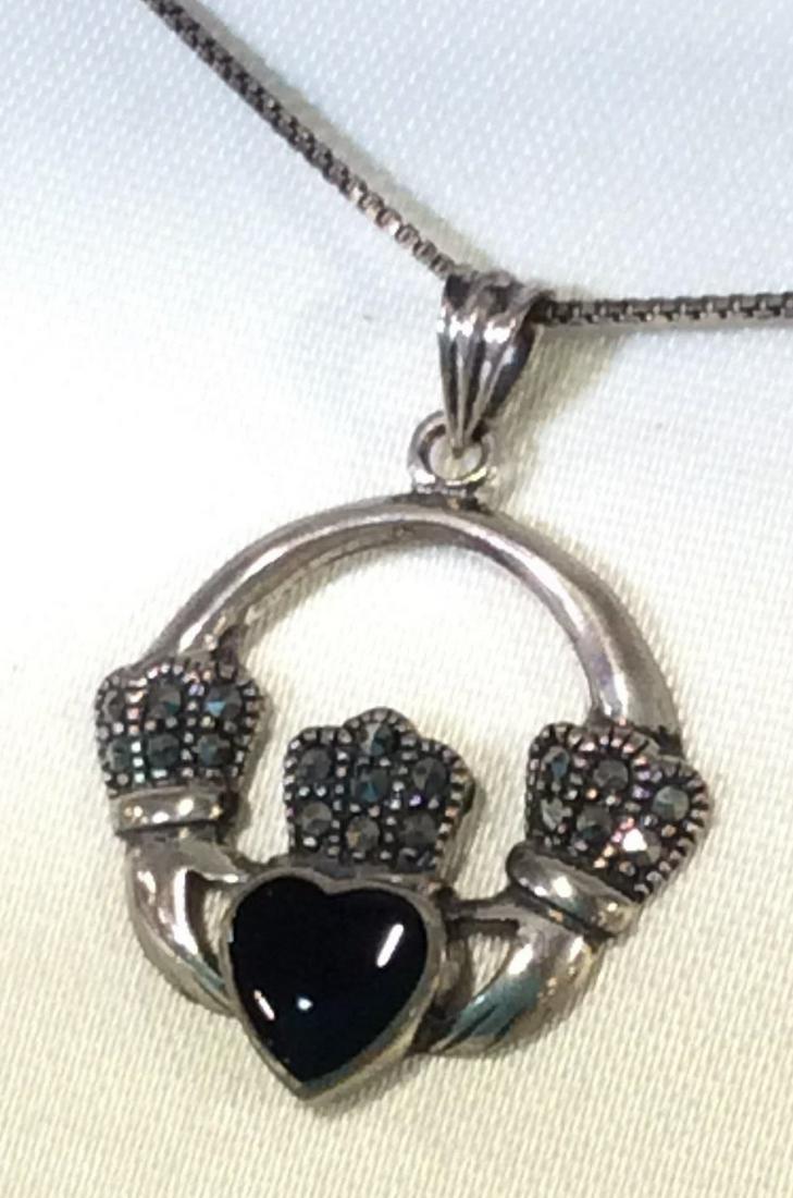 Marcasite &Sterling Silver Irish Claddagh Necklace: Sterling Silver Collection, Original Box, chain stamped 925 Italy with Letter A in circle. Pendant Marked 925A. Center heart stone onyx. Never worn, chain wrapped in bag behind display panel. Pendant 