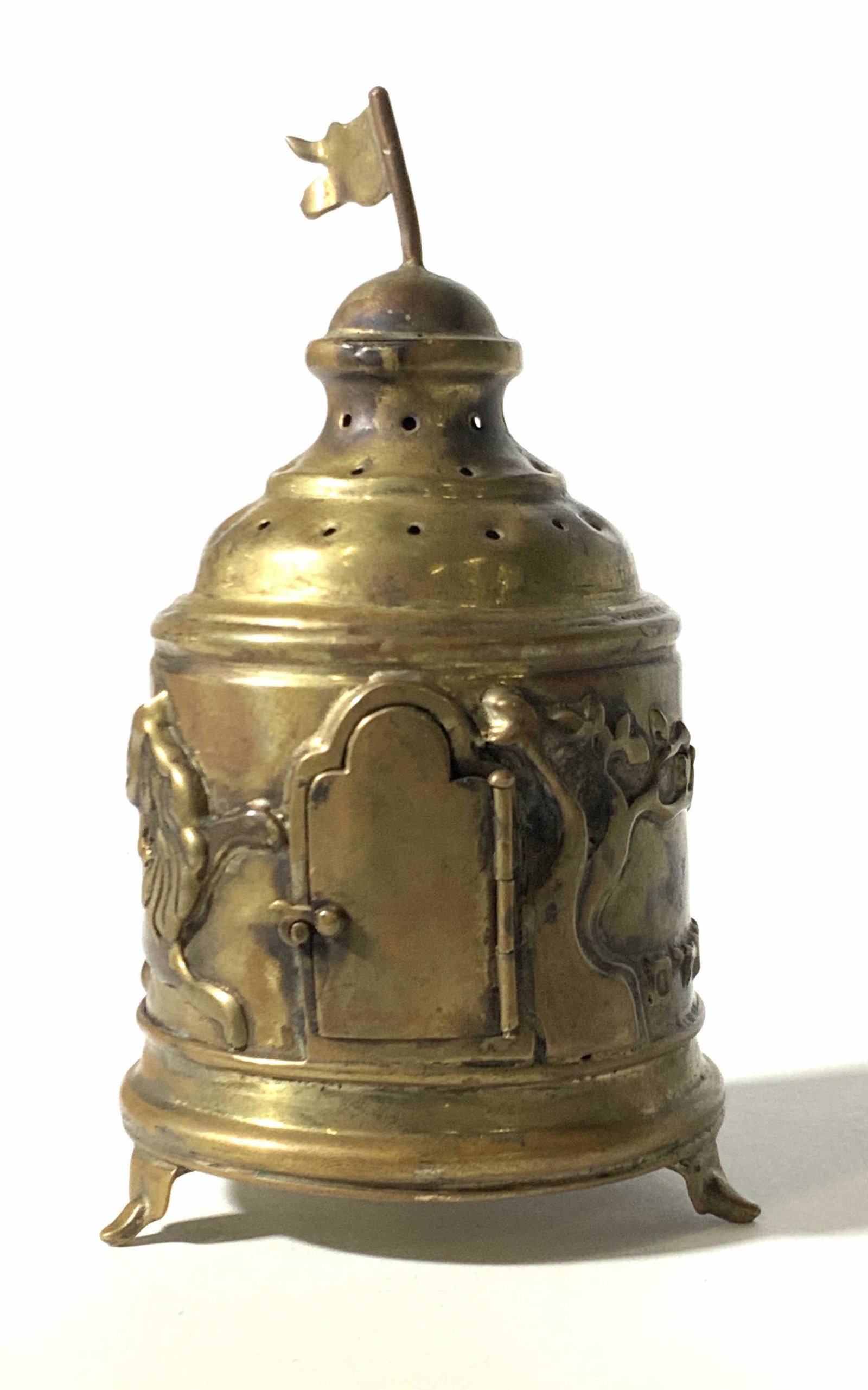Decorative Vintage Gold Tone Incense Burner Censer: Small metal footed building incense burner w/ hinged door & embossed Middle Eastern writing & designs. Lion headed character embossed along w/ tree. Pierced top for smoke to escape. Approx. 5.5 in. he
