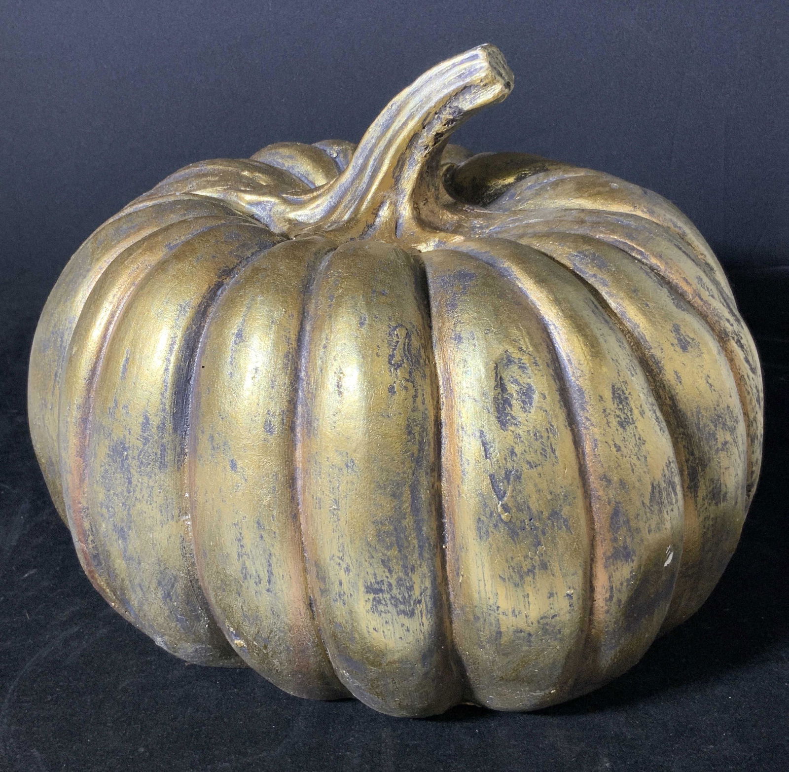 Decorative Gold Toned Centerpiece Pumpkin Sculpture: Lightweight gold toned hand painted metal pumpkin. Brush strokes throughout. outdoor or indoor decor for the autumn season. Approx. 10 in. height w/ stem. Approx. 10 in. width. Halloween decorations,