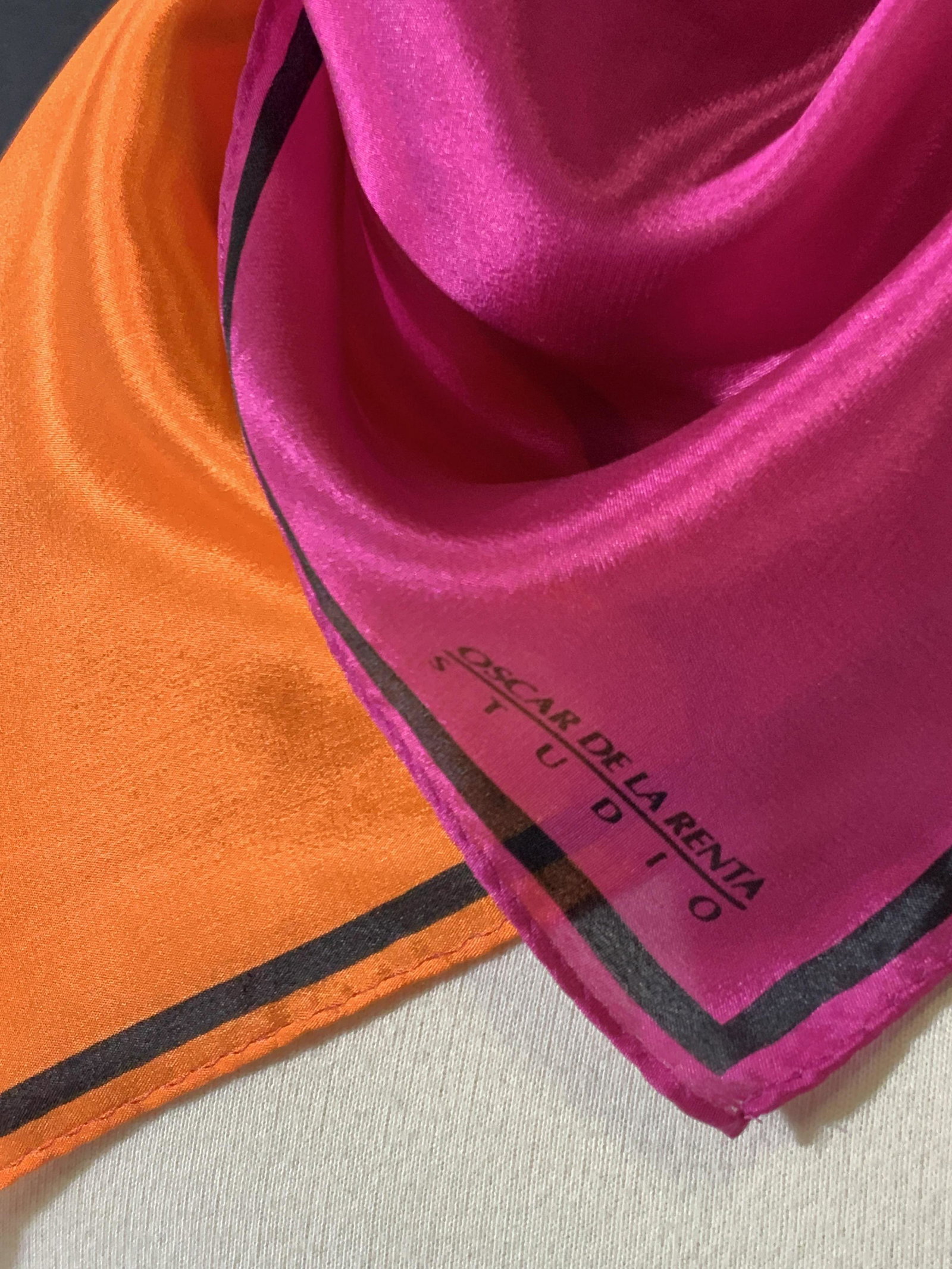 Luxury Oscar De La Renta Square Silk Scarf: Oscar De La Renta scarf. Vibrant pink, red, & orange square scarf. Tag reads: Oscar De La Renta Studio. 100% Silk. Dry Clean Only. OscarDe La Renta printed into scarf fabric corner as well. Approx. 32