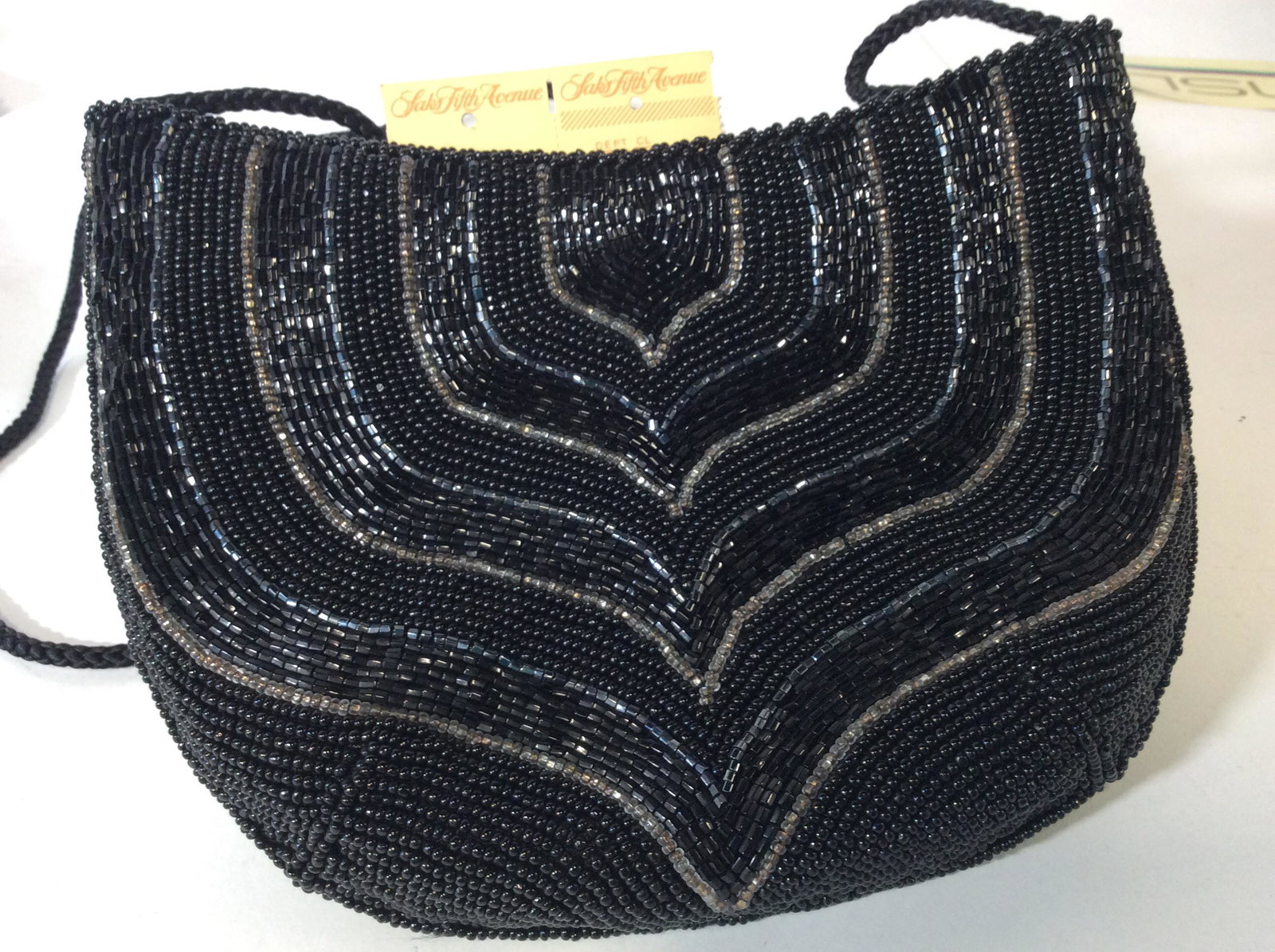 Black Seed Bead Evening Bag, Saks Fifth Avenue: bag with the original Luxury NYC Saks Fifth Avenue Department Store Tag ( not attached), And Org Saks Fifth Avenue Label Sewn I Side. Lined. Vintage, c mid to late 1980s . Art Deco Design, Black Beads