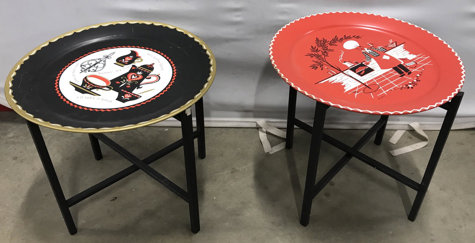 Pair Metal Tray Top Folding Tables: Pair of metal and wooden table trays. Collapsible wood frames, metal tray table tops. Each depicts different art. Measures approx 18 inches H, and 19 inches in diameter. Serving tray, side tables, acc