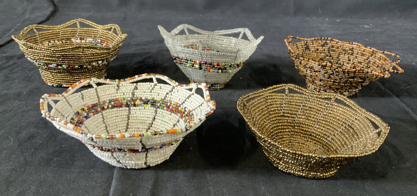 Lot 5 Beaded Bowls: Lot 5 Beaded Bowls, no apparent inscriptions or stamps, multicolored beadwork, smallest bowl measures 1 1/2 x 3 3/4 inches in diameter, Largest bowl measures 2 1/8 x 4 1/8 inches in diameter, in good