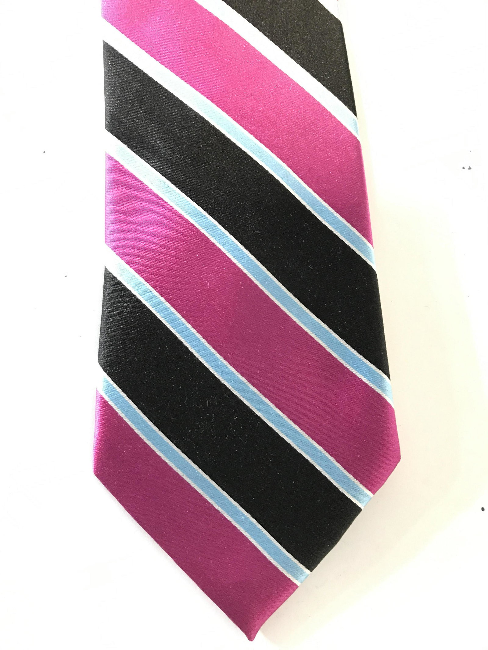 ISAAC MEZRAHI Silk Men’s Necktie: Necktie has label which reads ISAAC MEZRAHI NEW YORK. Tie appears to be silk. Piece has diagonal black, magenta white and light blue stripe detail. Piece when fully extended measures approximately 54 