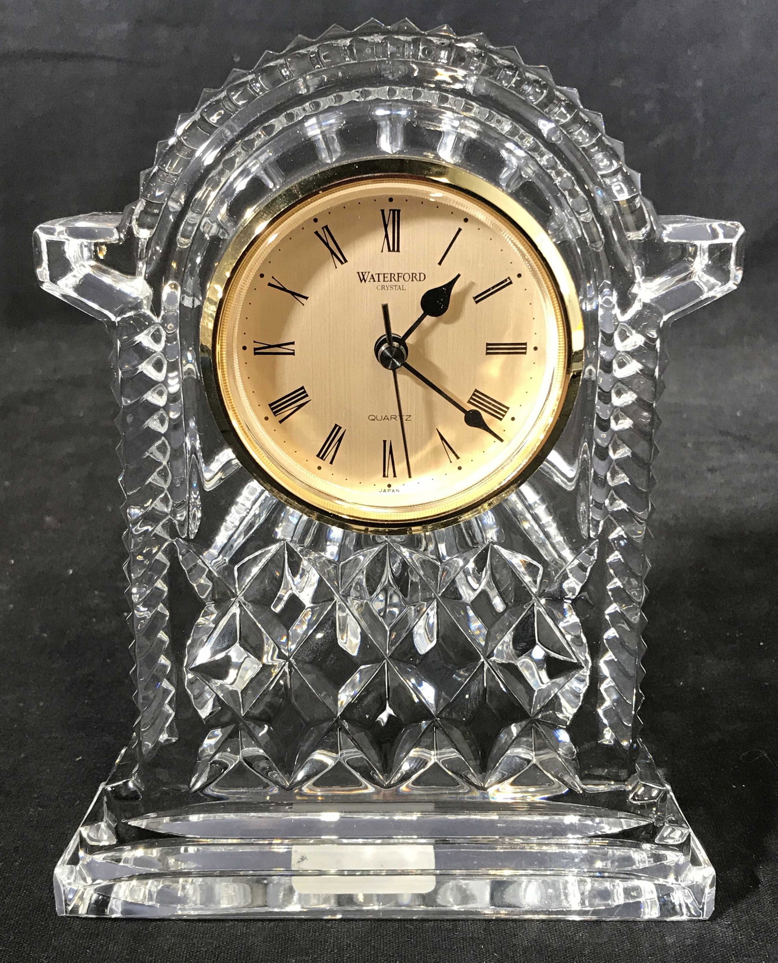 WATERFORD Cut Glass Carriage Clock: Cut glass carriage clock, possibly cut crystal. Possibly vintage. Clock face reads as WATERFORD CRYSTAL, QUARTZ. Measures approx 7 inches H, and 5.5 inches W. Underside reads as WATERFORD IRELAND. Wea