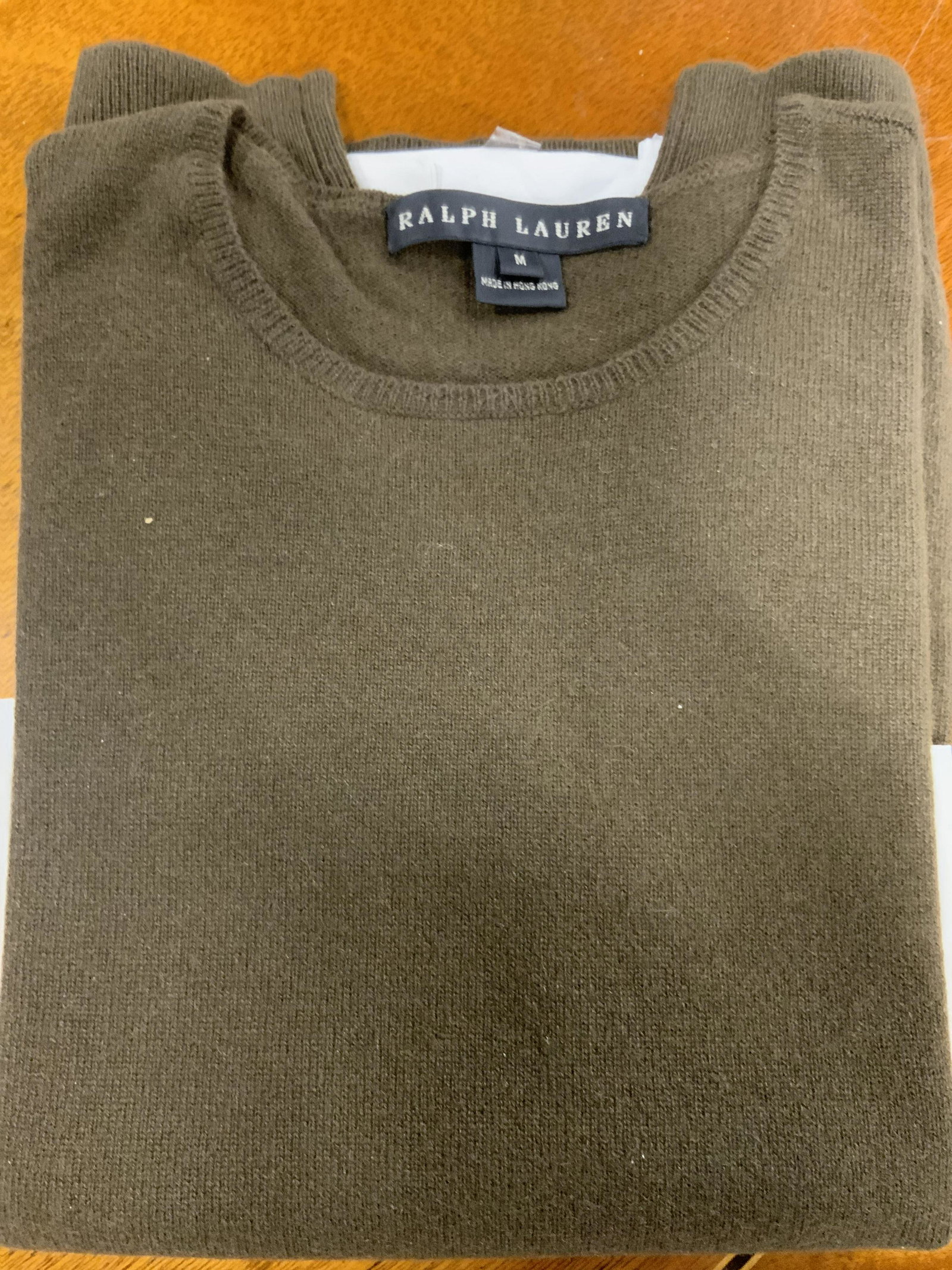 Luxury Ralph Lauren Cashmere Sweater, Org Tag: Size Med crew neck Luxury Ralph Lauren Cashmere Sweater in bronze color. Lightweight. Comes with Original tag in plastic sleeve. Reads Style 171362B Lot F025RO. Ribbed hem and cuffs. Luxury Designer B