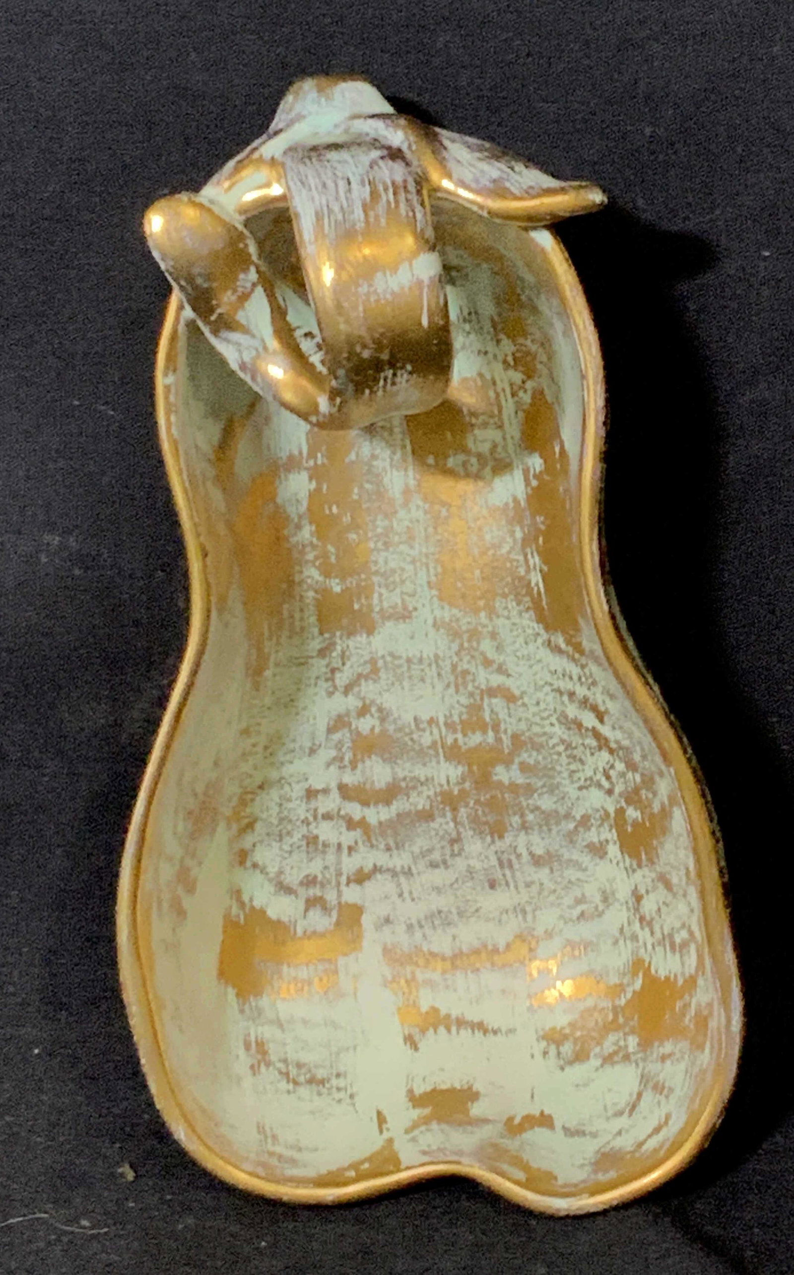 Hand Painted Gilt STANGL Ceramic Pear Shape Bowl: A Pear shaped STANGL Bowl with curly stem and paste up leaf, hand painted in antique gold # 3783( reads on verso). Hallmarked. Added green patina. Decor for side table, counter or vanity. Multi used.