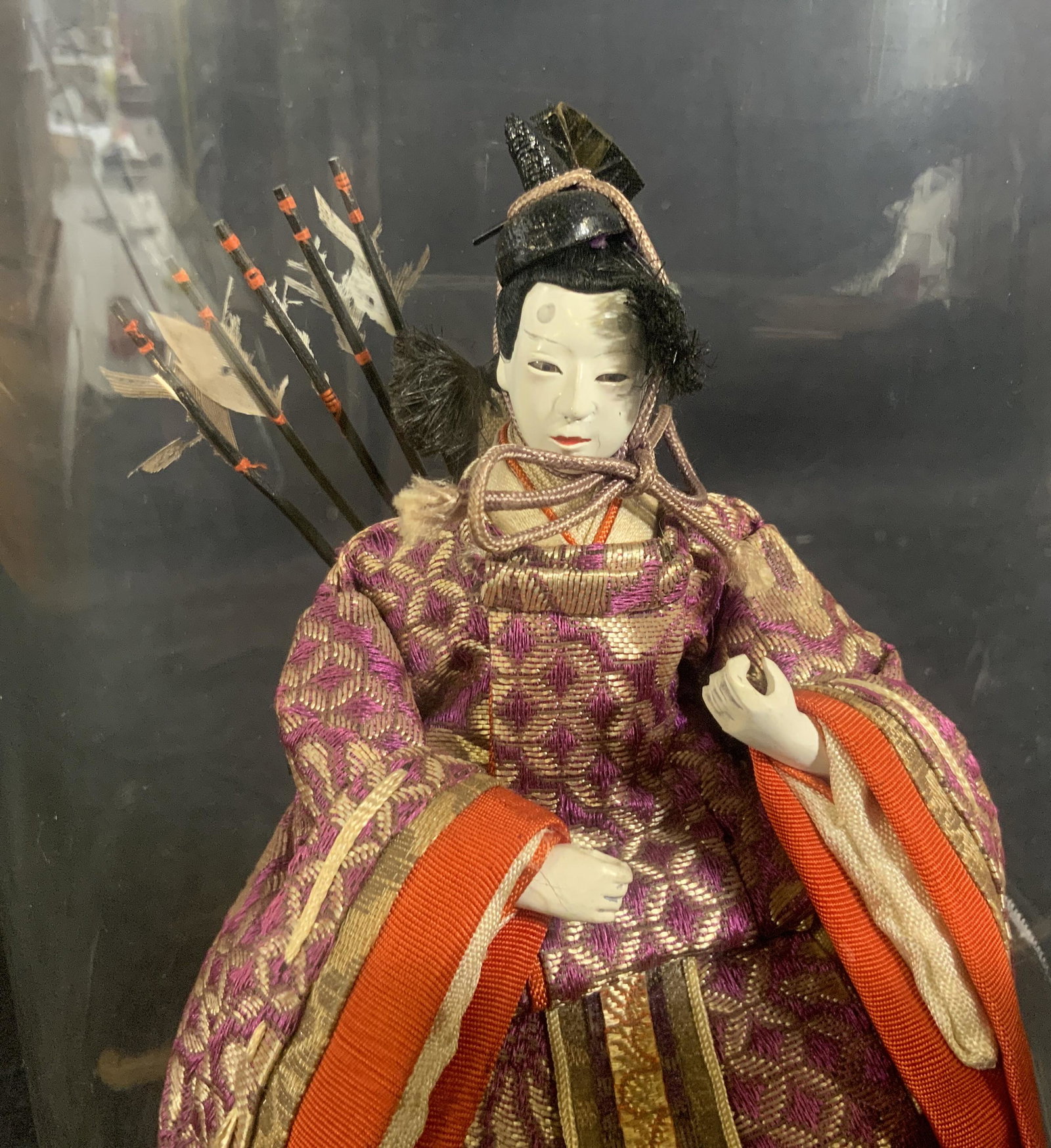 Japanese Daimyo Figurine: Japanese Daimyo Figurine, no apparent inscriptions or stamps, Seated figure in traditional Japanese clothes and quiver, measures 11 inches tall x 6 7/8 inches in diameter at widest point, some wear to