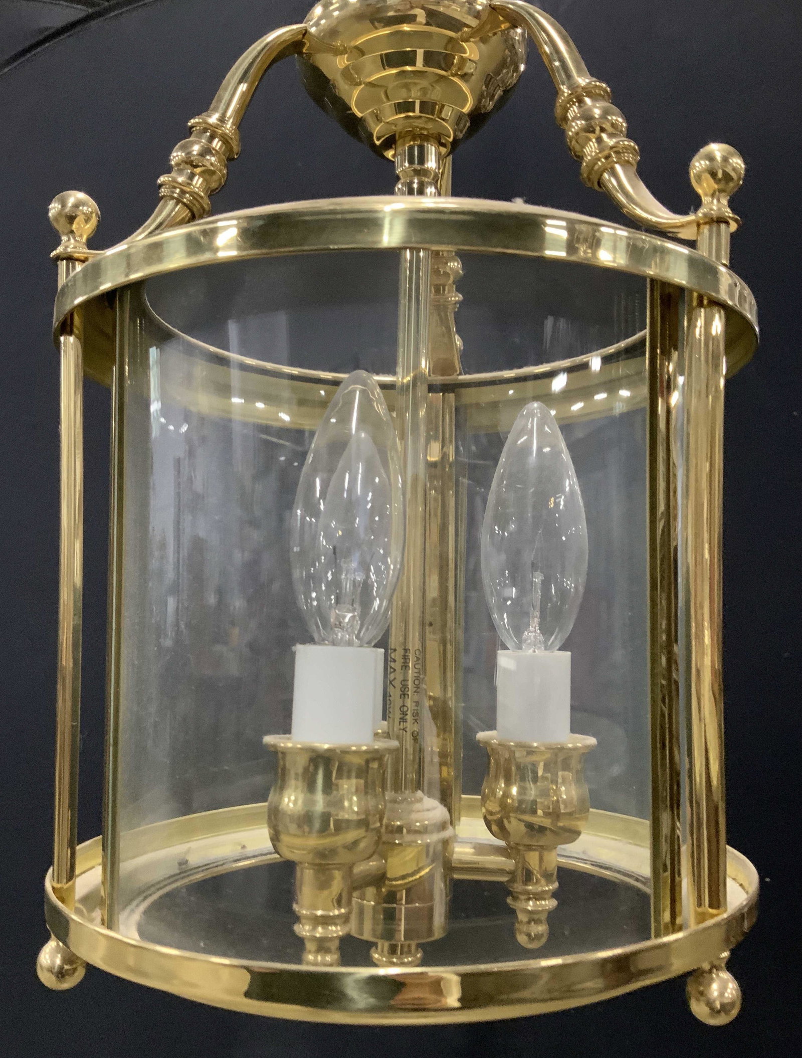 Brass and Glass 3 Light Chandelier: Tubular Chandelier with 3 chandelier lights encased in glass, upper and lower sections open. All Polished brass design, In between a modern and vintage style. Comes with ceiling plate and bracket, wir