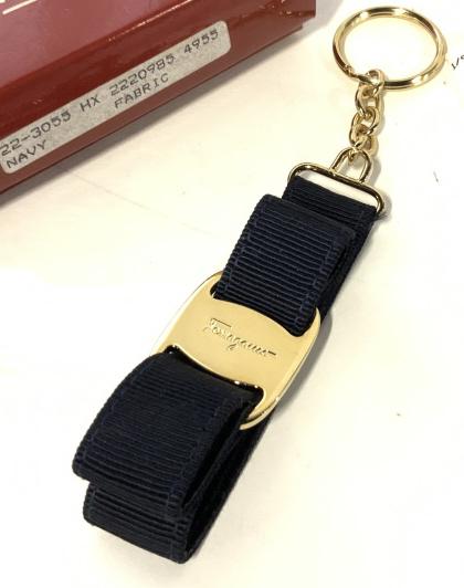 Signed Ferragamo Key Chain, Org Box: Salvatore Ferragamo Navy Blue Fabric Key Chain with shiny yellow toned hardware. Buckle plate signed, impressed Ferragamo. Includes original box, in good condition, style no. 22-3055/15 . 6.25 in long