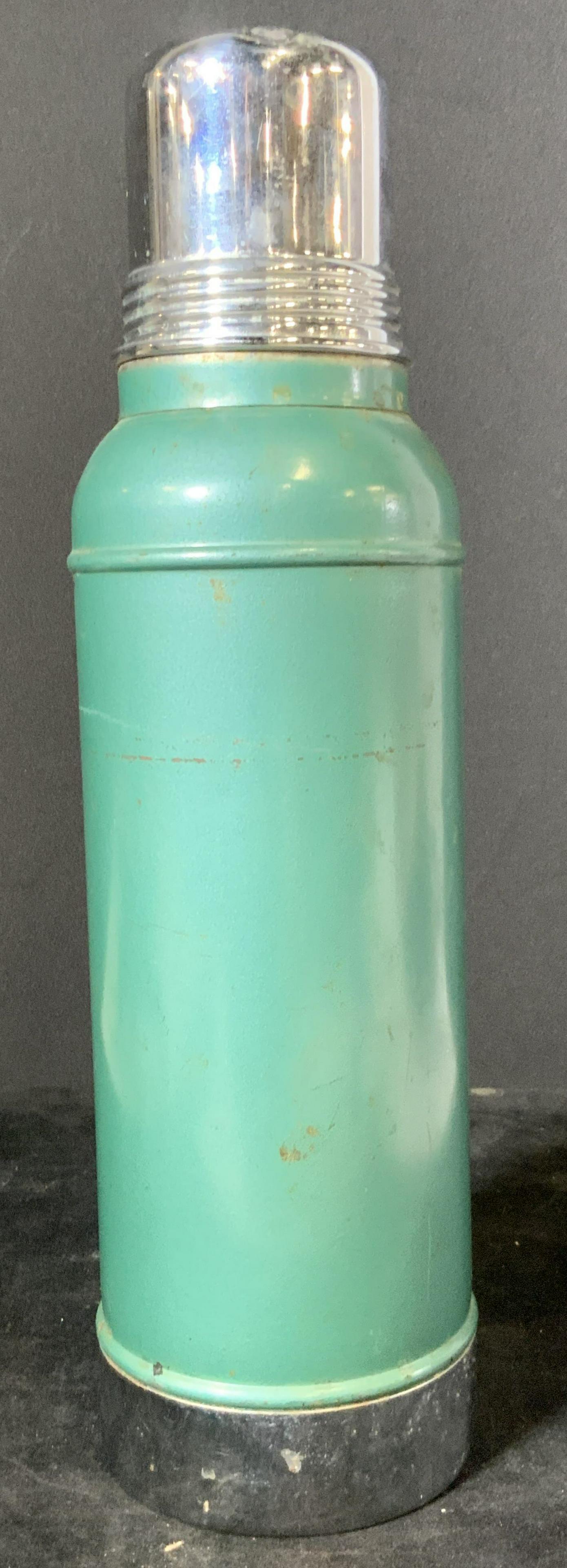 Vintage Teal Stanley Corked Thermos: A vintage Stanley Corked Thermos. Teal and polished silver screw-top lid & base, possibly stainless steel. Cork underneath lid. Underside reads: Stanley Super Vac. It Will Not Break. Stanley Insulatin