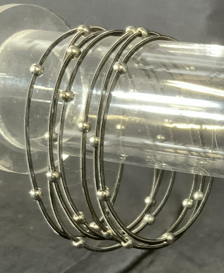Lot 13 Metal Bangles: Lot 13 Metal Bangles, comprised of black springs and silver toned metal beads, all measure 2 1/2 inches in diameter, in good condition, Bangles, bracelet, Jewelry, women’s accessory, wearables. ladi