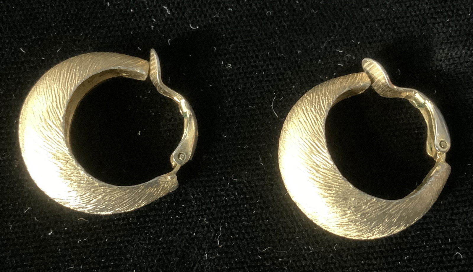 Trifari Gold Toned Clip on Earrings: Trifari Gold Toned Clip on Earrings, inscription to earrings reads ‘Trifari’, Both measure 7/8 x 7/8 inches, some tarnishing but overall in good condition, Trifari, clip on earrings, clip back ear