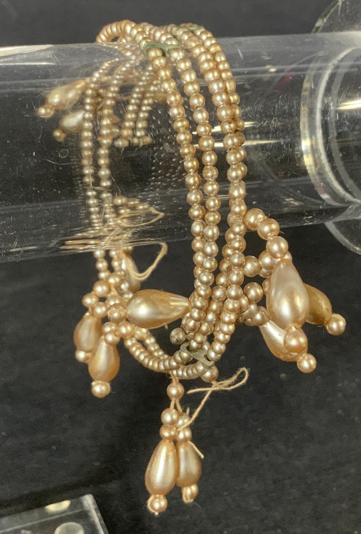 Pearlescent Beaded Bracelet: Faux Pearl Bracelet, no apparent inscriptions or stamps, measures 2 3/4 inches in diameter, larger pearls measure 3/8 inches long, needs repair, Costume jewelry, jewelry, women’s accessory, faux Pea