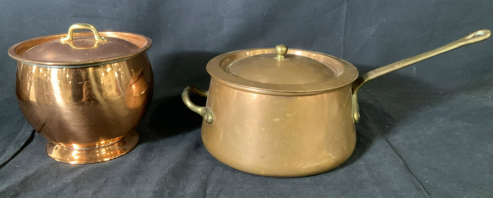 Pair Copper Cookware: Pair Copper Cookware, no apparent inscriptions or stamps, Bowl measures 5 1/2 inches tall with lid, 6 inches in diameter, pot measures 5 inches tall x 14 inches wide, some wear and tarnishing to pot, 