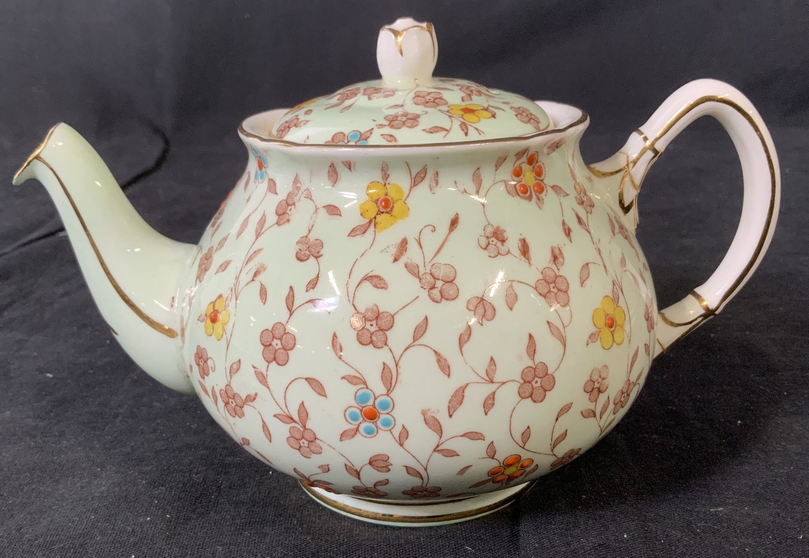 Old Royal Bone China Teapot: Old Royal Bone China Teapot, stamp to base reads ‘EST 1846 Old Royal Bone China England’, floral design, measures 4 1/4 inches tall x 6 3/4 inches at widest point, in good condition, Old royal, bo
