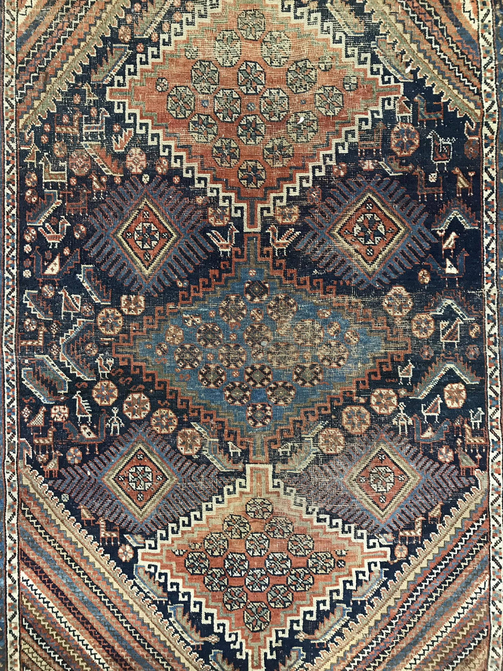Antique Handmade Turkish Wool Rug: Rug is wool and handmade. Piece is antique. Rug has intricate multi toned geometric detail. Rug has small fringes. Piece measures approximately 77 inches long 54 inches wide. Rug, carpet, area rug, wo