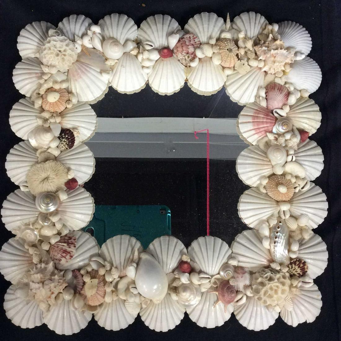 Handmade Scallop Shell Wall Mirror: Seashell Mirror, whiteish touches of pink, Scallop Shells Border int & exterior edges. Center and side wire hoops for hanging. Mirror affixed to partial board and secured with pieces of wood. Couple c