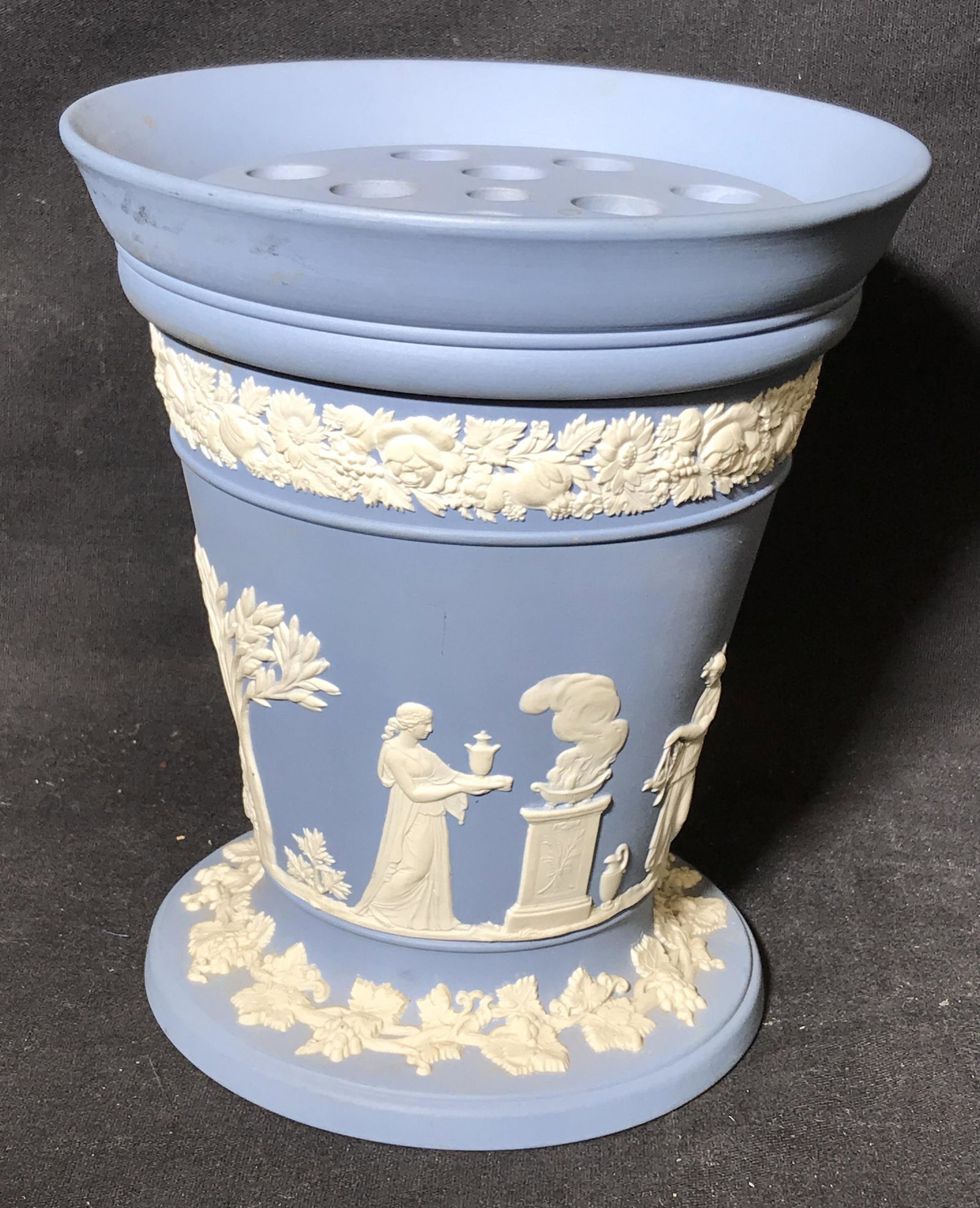 Vintage WEDGWOOD Vessel W Pierced lid: Vintage Jasperware vessel with pierced lid, by WEDGWOOD. Depicts several robed figures, base and rim are decorated with floral and vine like patterns. Underside reads as WEDGWOOD, MADE IN ENGLAND. Mea