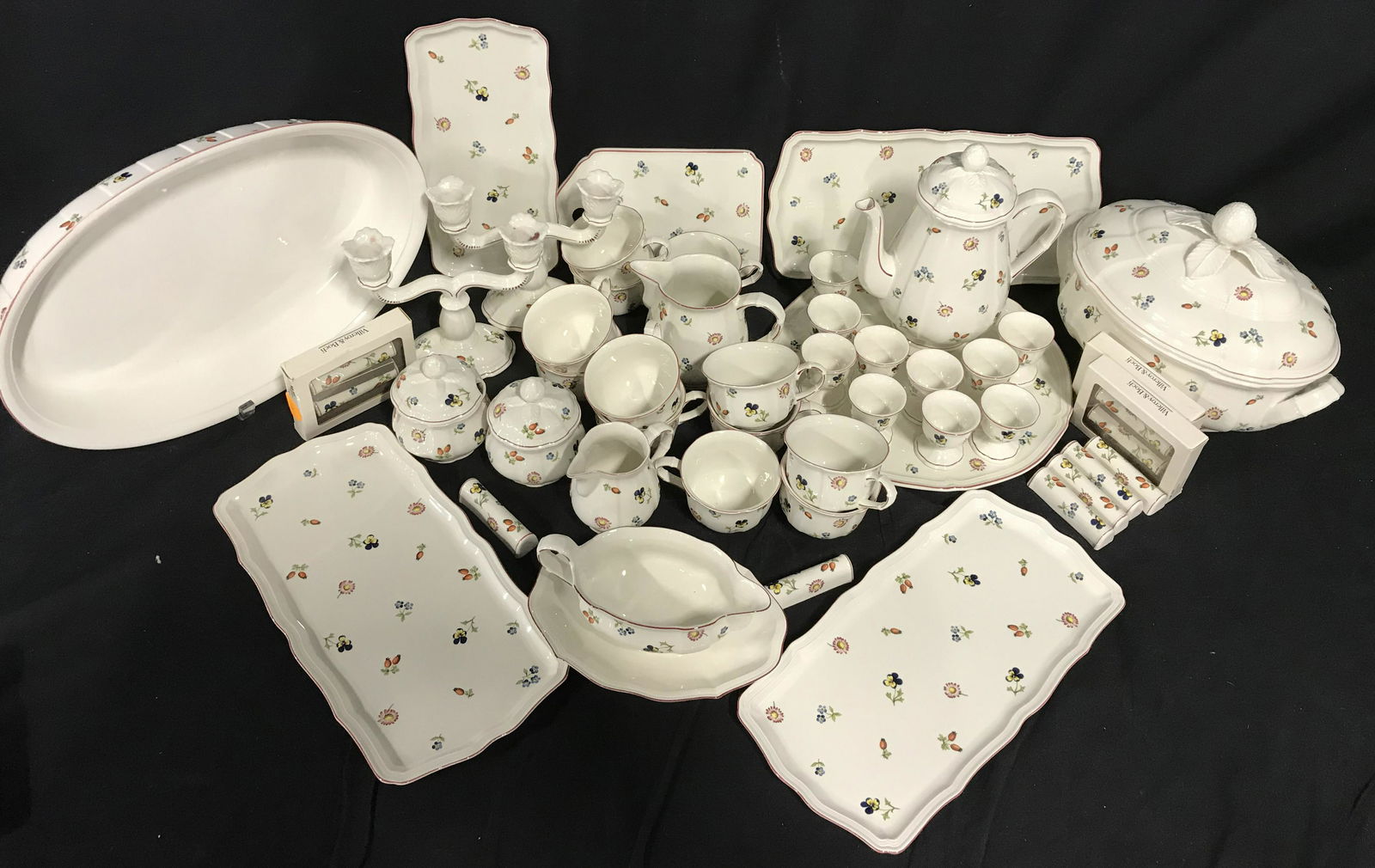 Set5 VILLEROY&BOCH Porcelain Dinner Service: PORCELAIN VILLEROY & BOCH table service items. Pieces are glazed, depicts all over flower prints. Includes 12 knife rests, 12 teacups, a tureen, coffee pot, 2 sugar bowls, a baking dish, gravy boat, 2