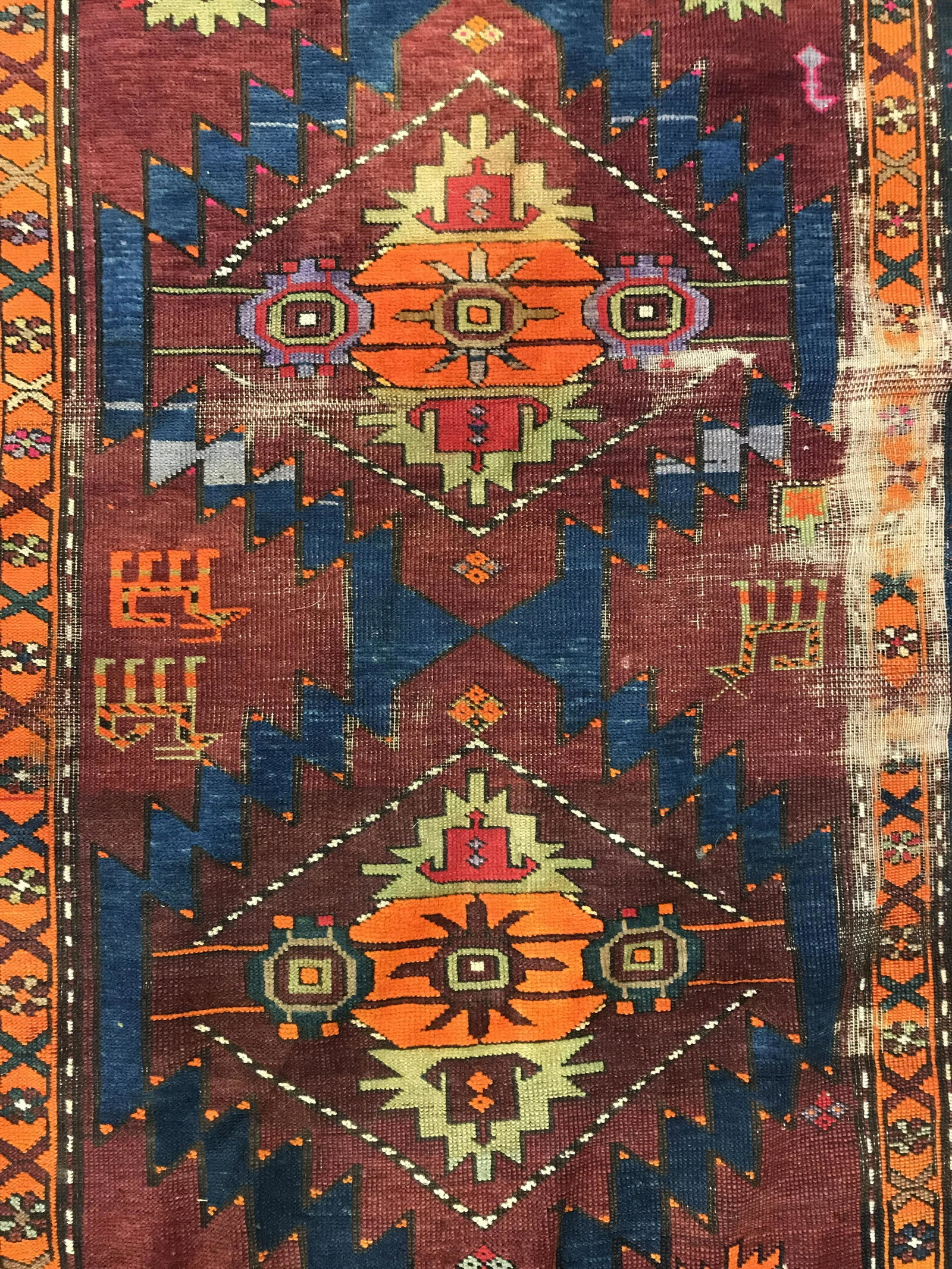 Vintage Geometrically Detailed Handmade Wool Rug: Rug is woo, and handmade. Icee is vintage possibly antique. Rug contains intricate multi toned geometric detail. Piece measures approximately 89 inches long 50 inches wide. Rug, carpet, area rug, wool
