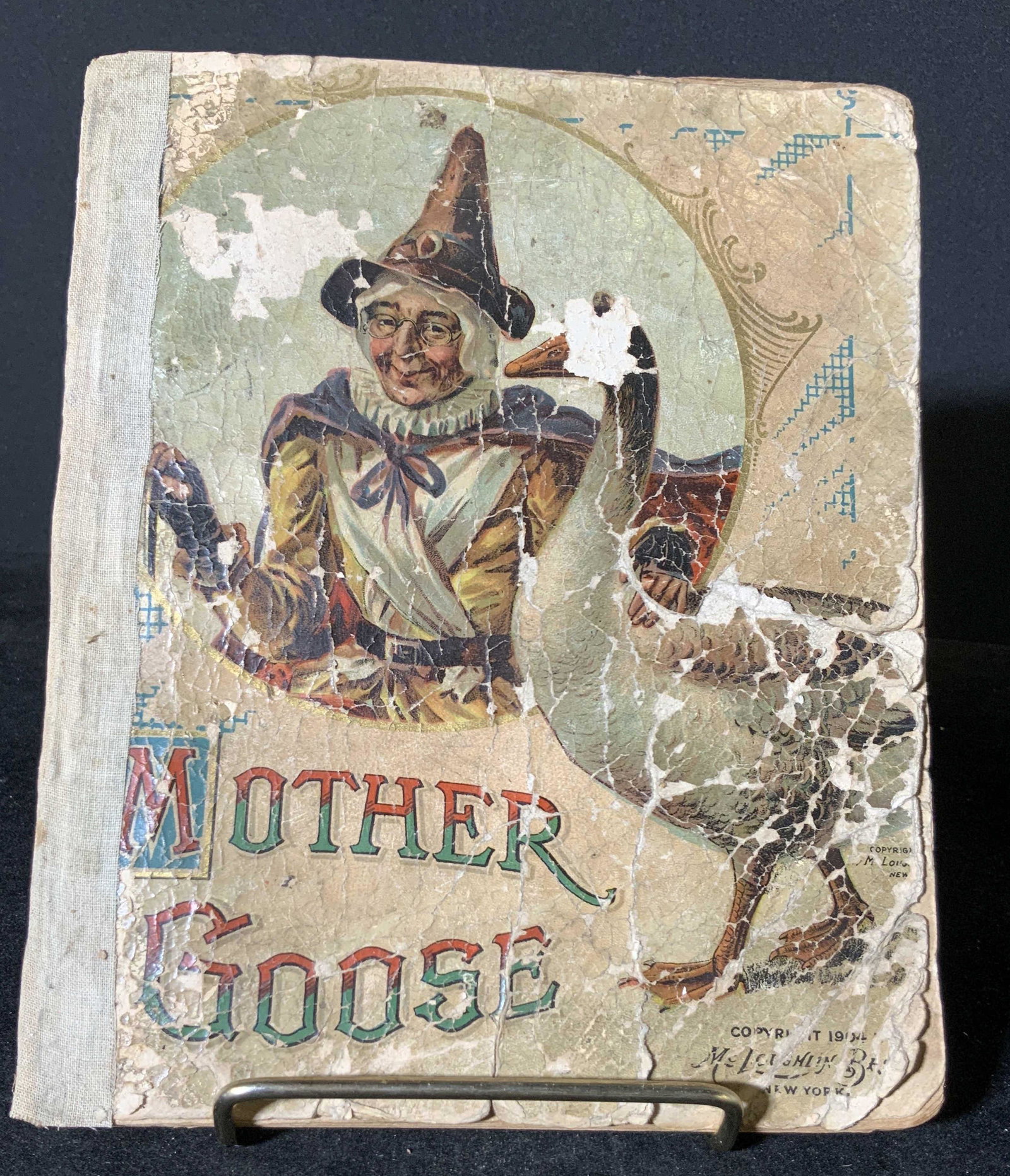 Antique Mother Goose’s Rhymes Book: Possibly antique Mother Goose’s Rhymes book published by Mc. Loughlin Bros. New York. Delicate antique condition, wear to pages / missing pages, no back cover. Approx. 7.5 in. height. Approx. 5 in. 