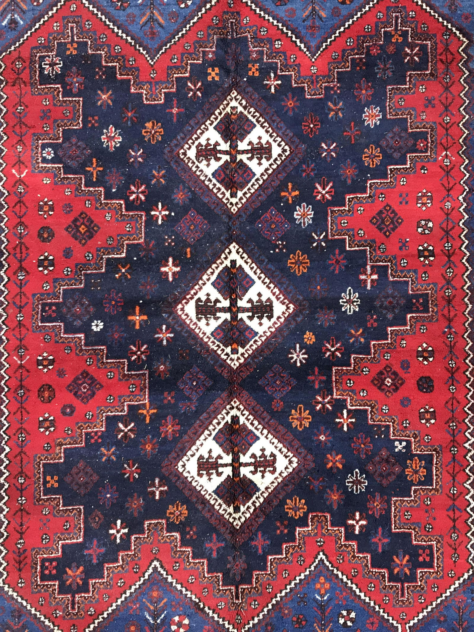 ANH Vintage Handmade Persian Wool Rug: Underside has tag which reads ANH MADE IN IRAN. Rug is wool and handmade. Piece is vintage possibly antique. Rug contains intricate multi toned geometric detail. Rug is fringed. Piece measures approxi