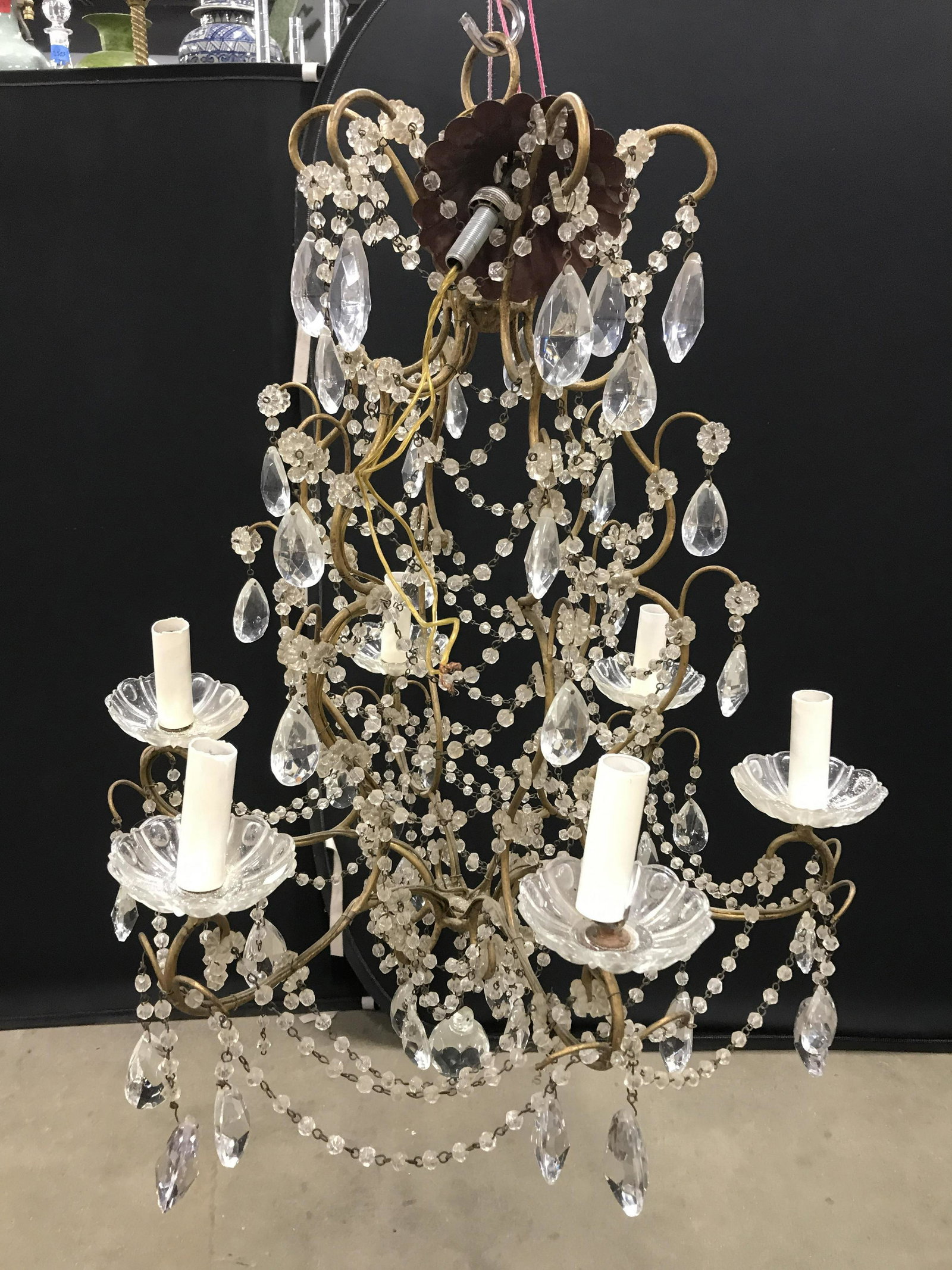 Vintage 6 Arm Chandelier: Chandelier is vintage possibly antique. Piece appears to possibly be brass. Chandelier has glass chain linked structures & hanging Glass tears. Piece measures approximately 29 inches tall 20 inches wi