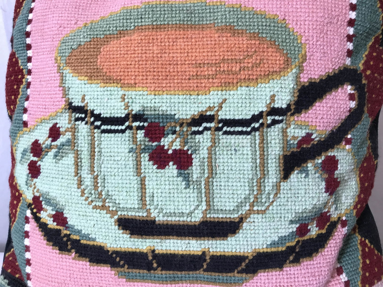 Vintage Needlepoint Pillow: Pillow is vintage and needlepoint. Piece contains floral, leaf , vine teacup and saucer detail. Piece measures approx 13 inches square. Pillow, vintage pillow, needlepoint pillow, floral pillow, home