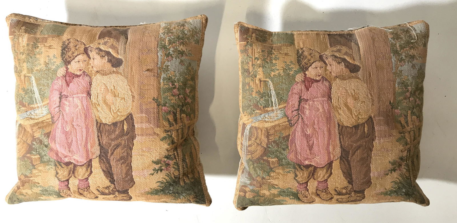 Pair Vintage Pillows W Boy & Girl Figures: Lot includes 2 pillows. Each are vintage and depicts a girl and boy Figural outdoors. Each are possibly hand made. Each measures approx 9 inches square. Pillows, vintage pillows, home decor, home acce