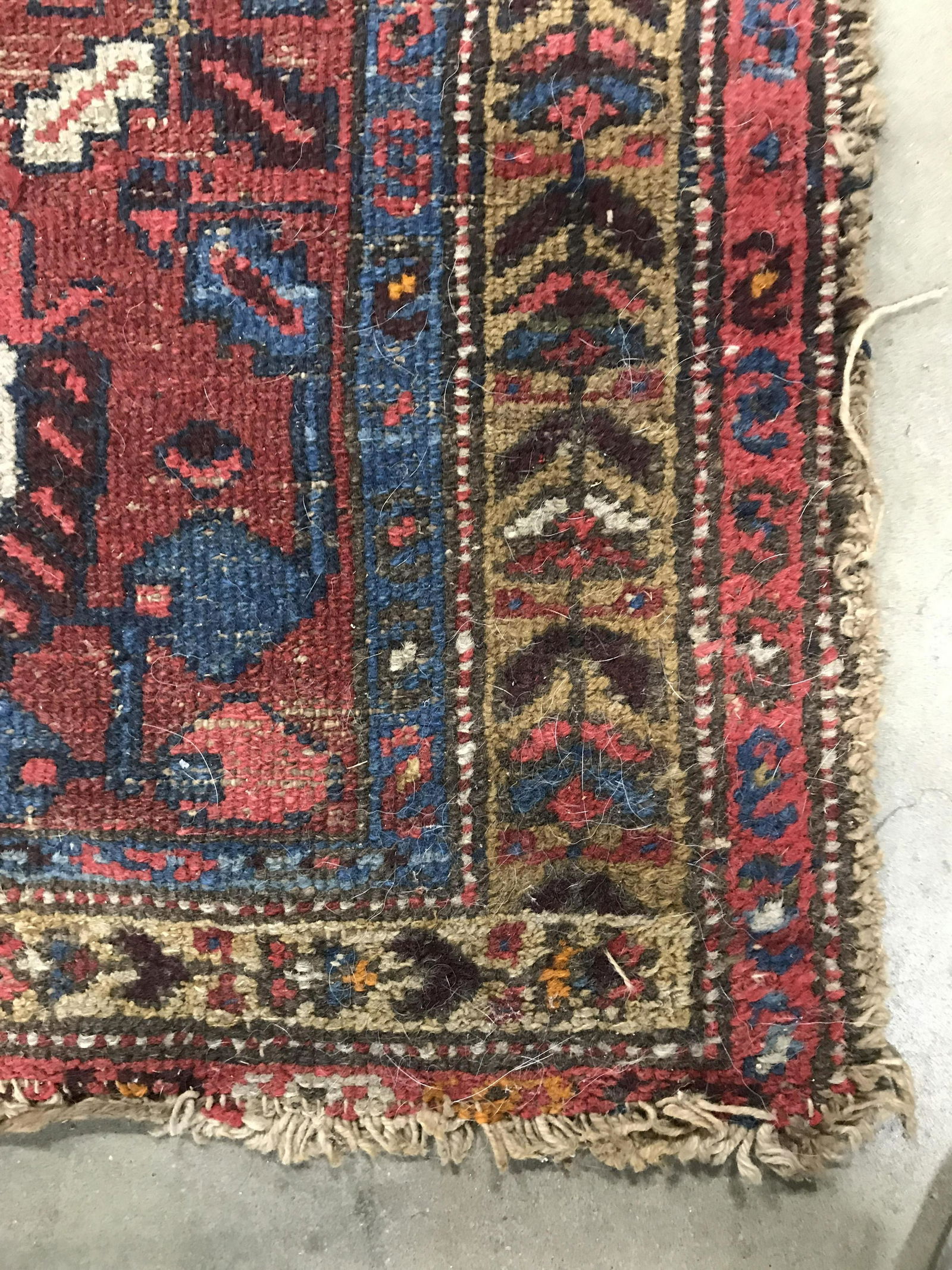Vintage Handmade Persian Wool Runner: Runner is wool and handmade. Piece is vintage possibly antique. Rug contains intricate multi toned floral leaf and geometric detail. Piece measures approximately 105 inches long 28 inches wide. Runner