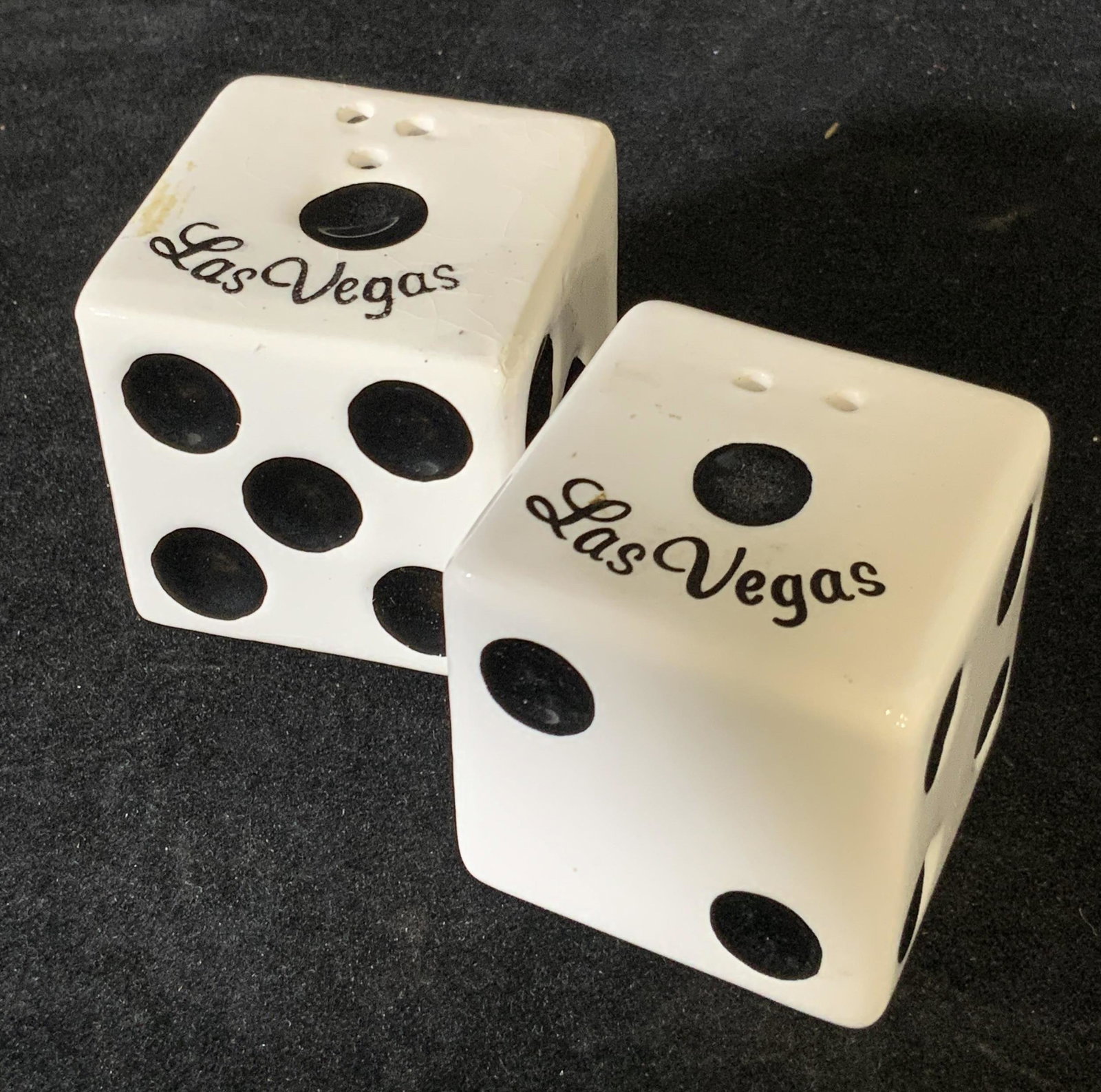 Vintage Porcelain Dice Salt & Pepper Shakers: Pair of vintage dice salt and pepper shakers. Tops of dice read: Las Vegas. Black circles impressed into white. Approx. 1.5 x 1.5 in. Salt and pepper shakers, vintage collectibles, vintage kitchen acc